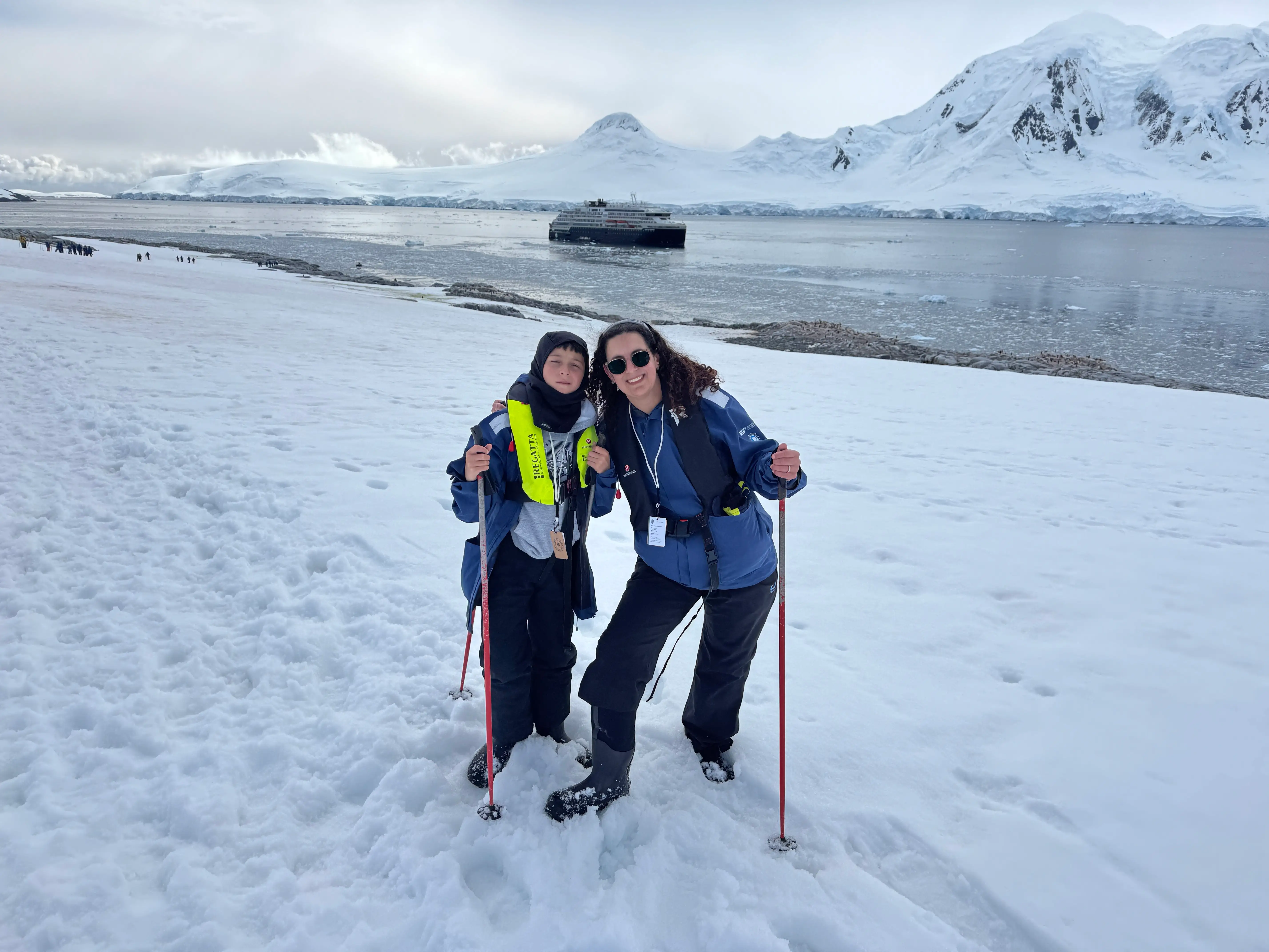 The author and her son pose while skiing in Antarctica.