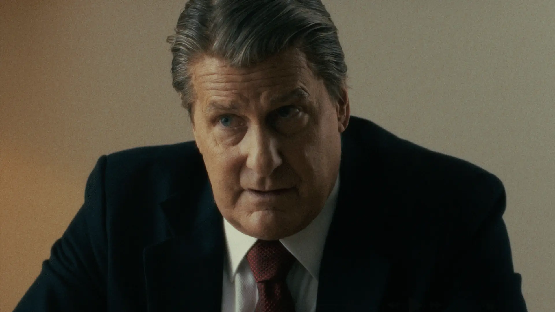 Jeff Daniels in a suit and tie in The Brink of War