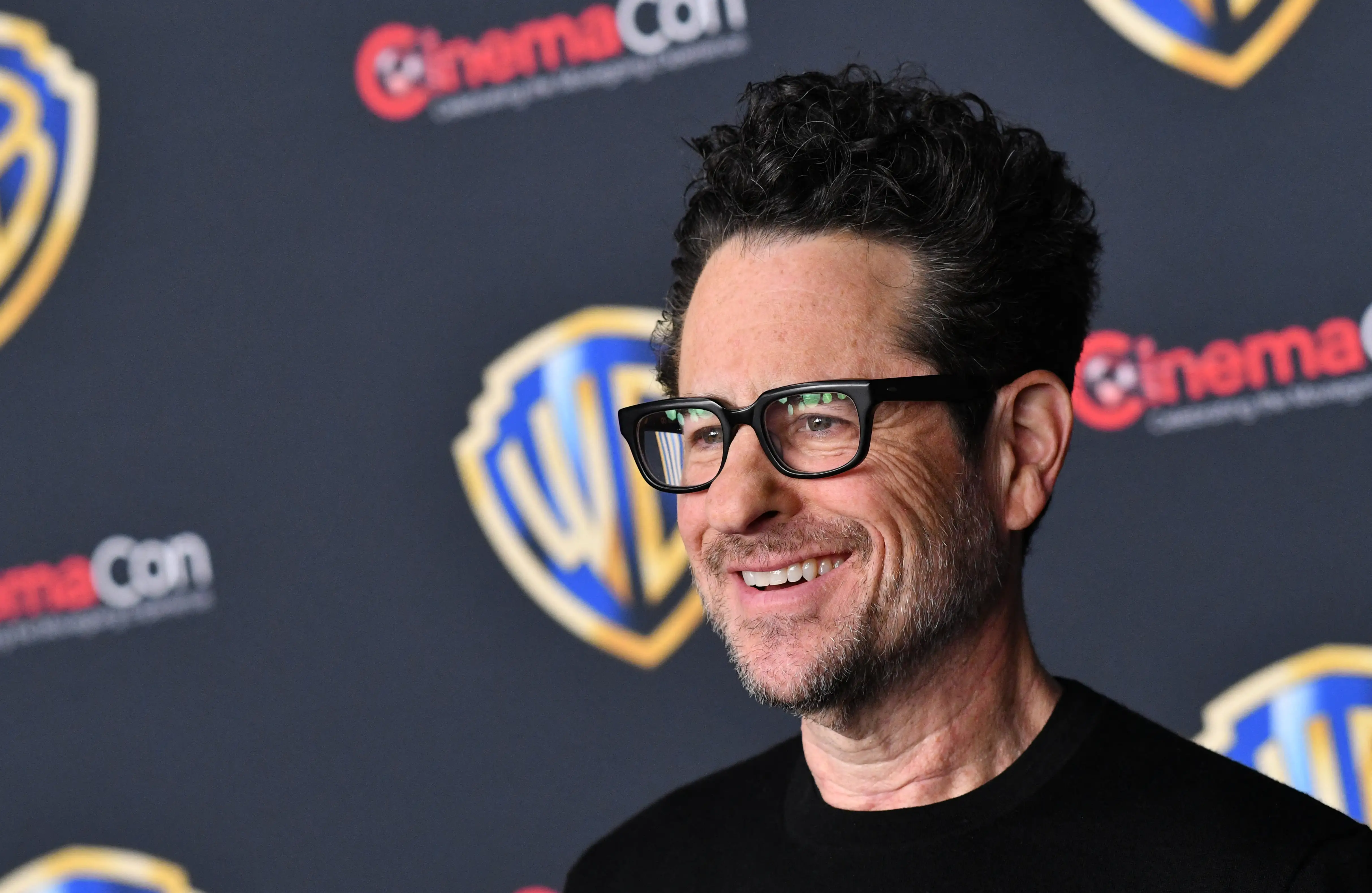 J.J. Abrams in a black shirt smiling