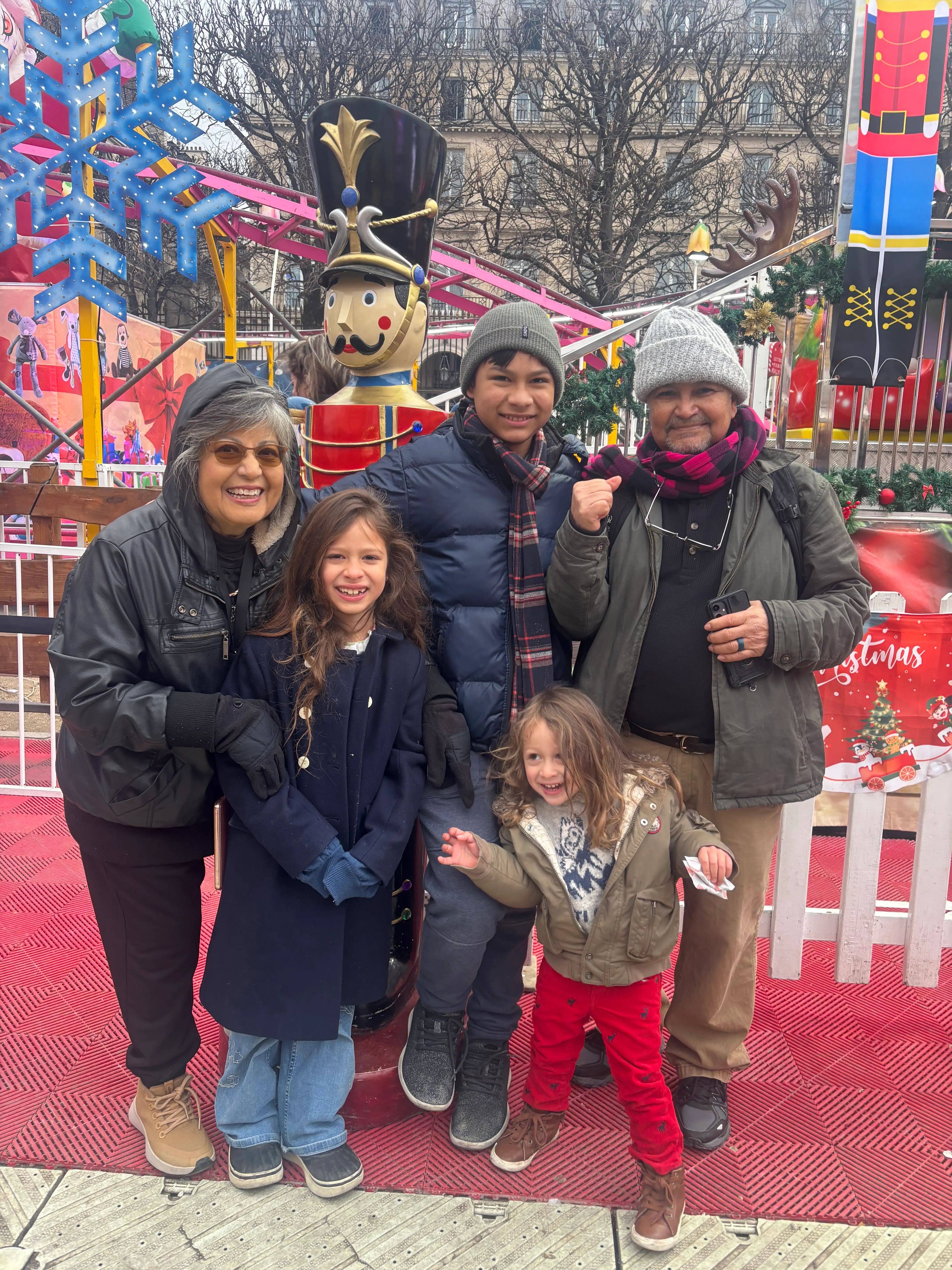 The author's family in front of Christmas decorations in Paris.