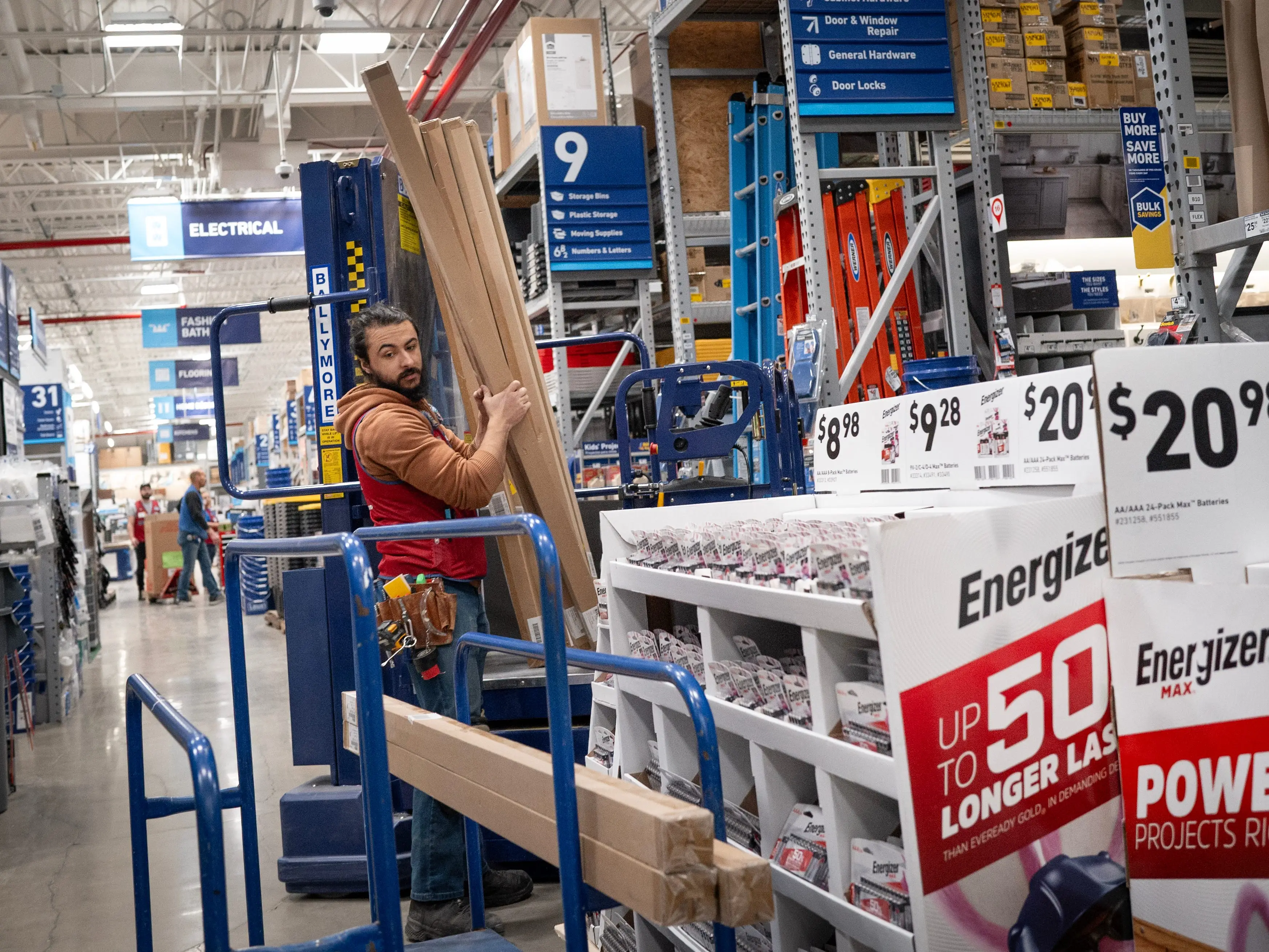A worker helps to stock merchandise at a Lowe's home improvement store on February 26, 2025 in Chicago, Illinois.
