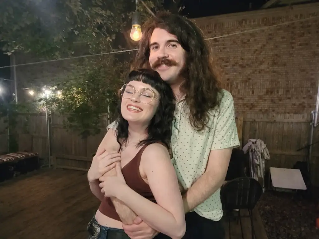 A couple hold eachother in an embrace.