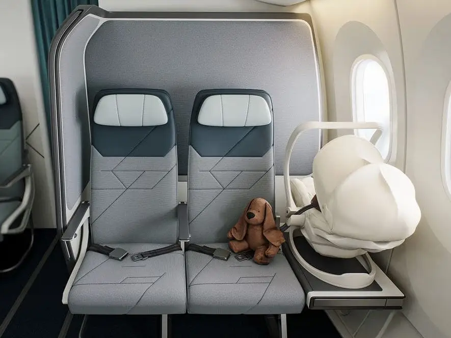 Collins' SkyNook with car seat on side table.