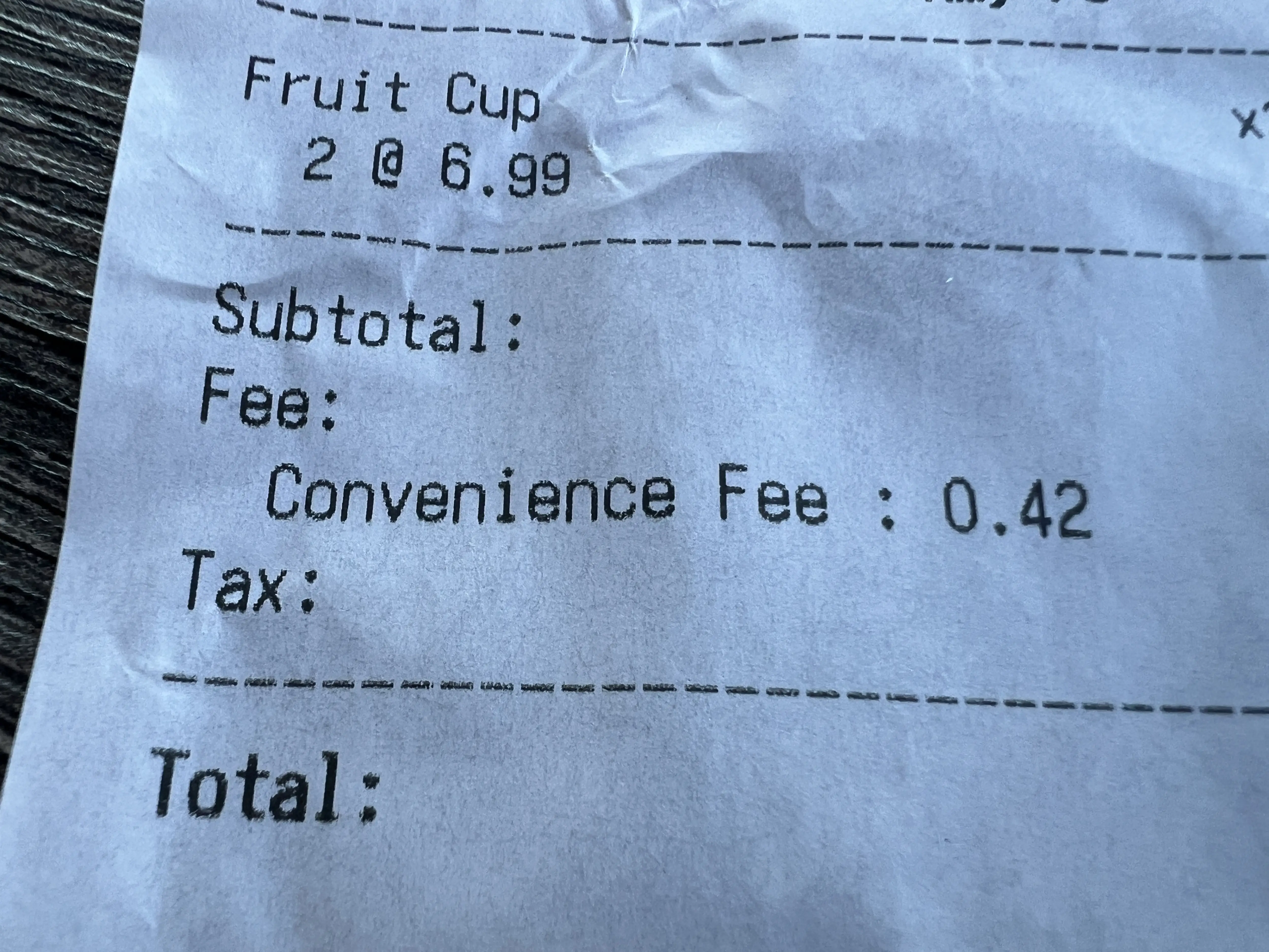 A receipt showing an added 'convenience fee'.