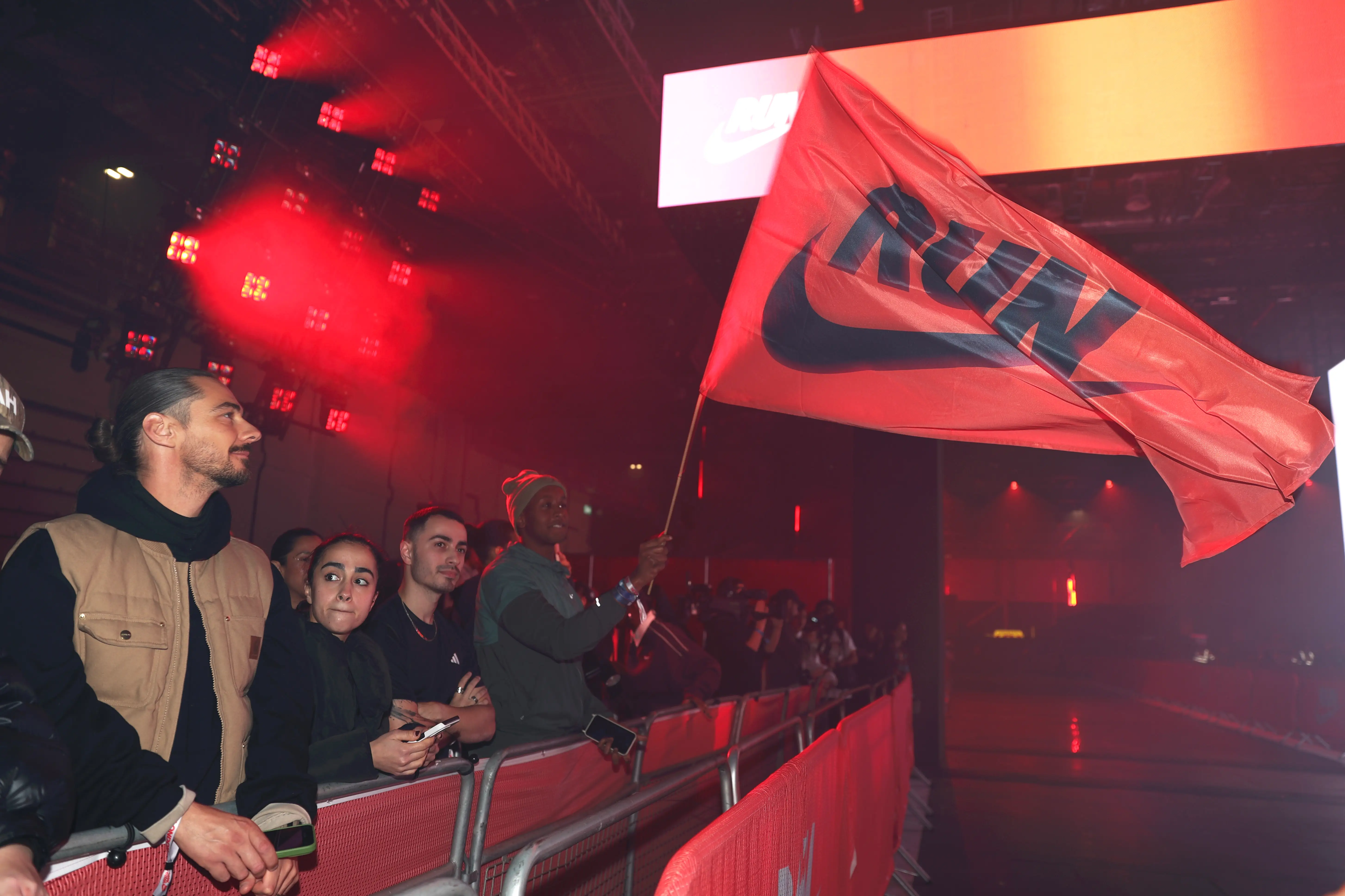 Person holding nike flag