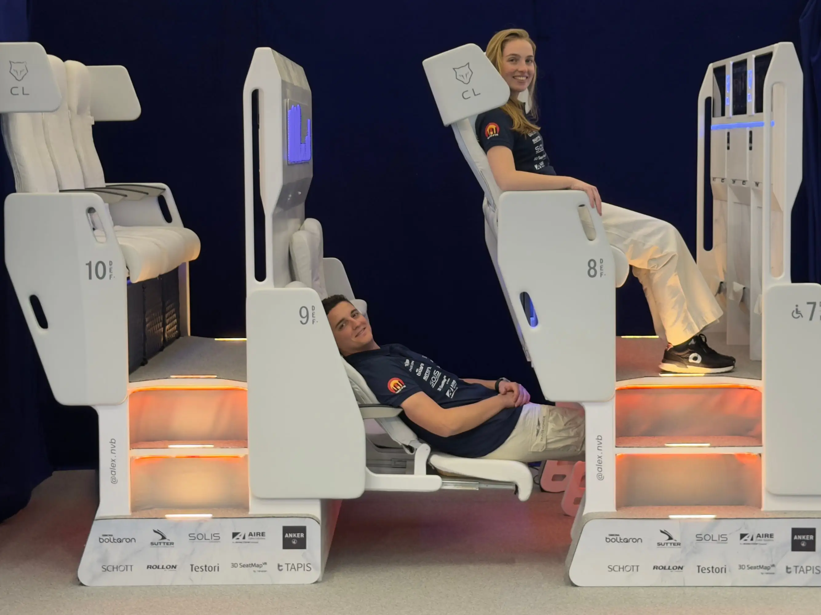 Two people in the Chaise Lounge double-decker lounger.