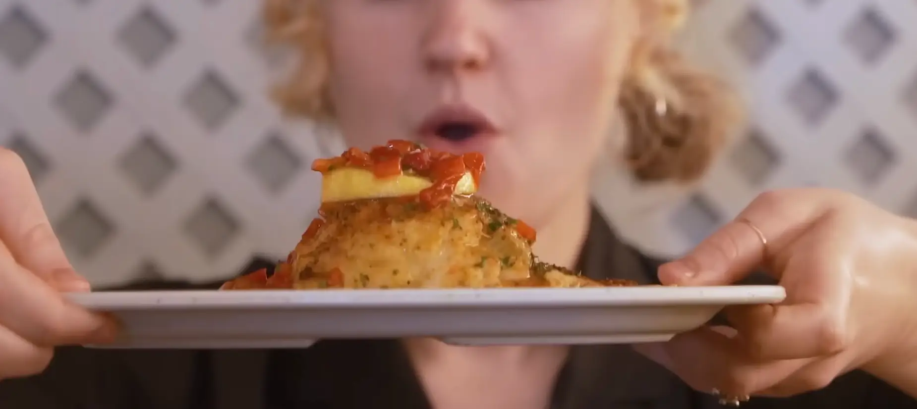 Play with catfish topped with red pepper and lemon.