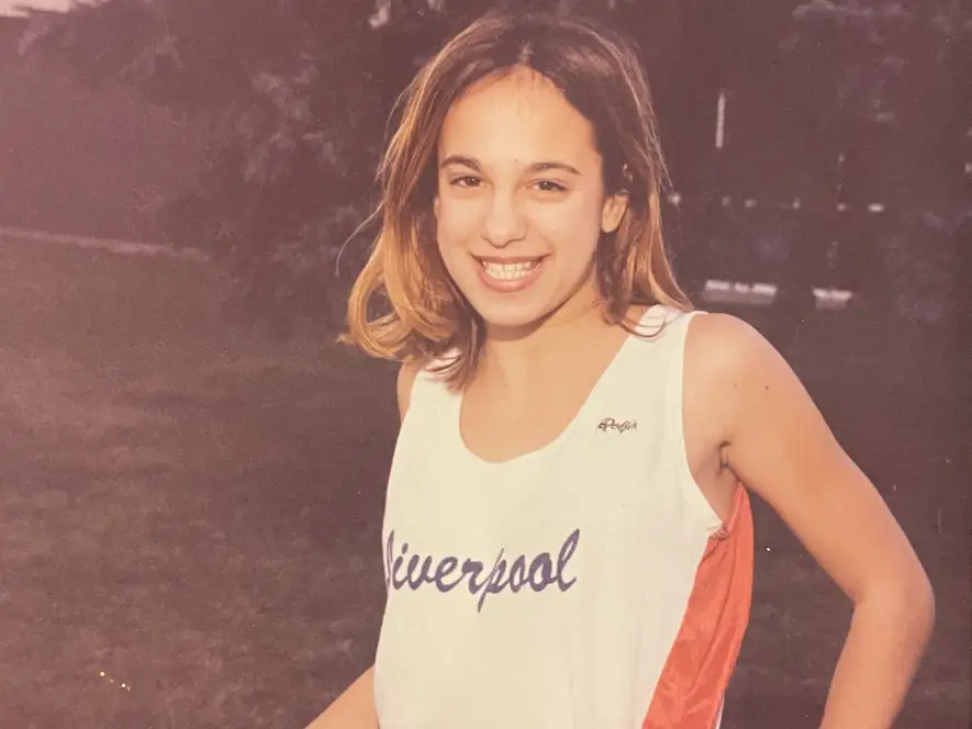 Isabella Jade as a kid wearing her track uniform