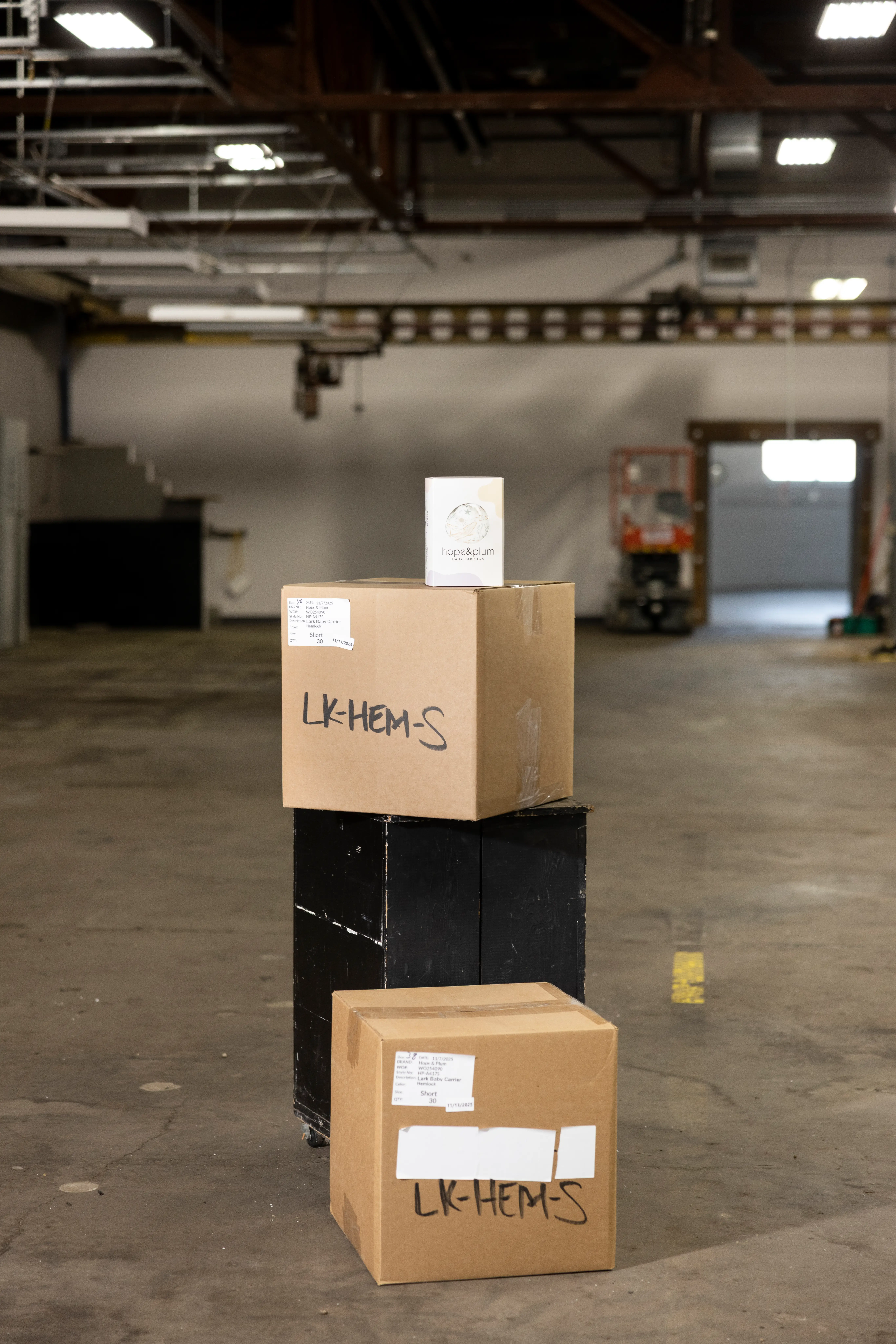 A pile of boxes in Hope&Plum's new warehouse in MN.