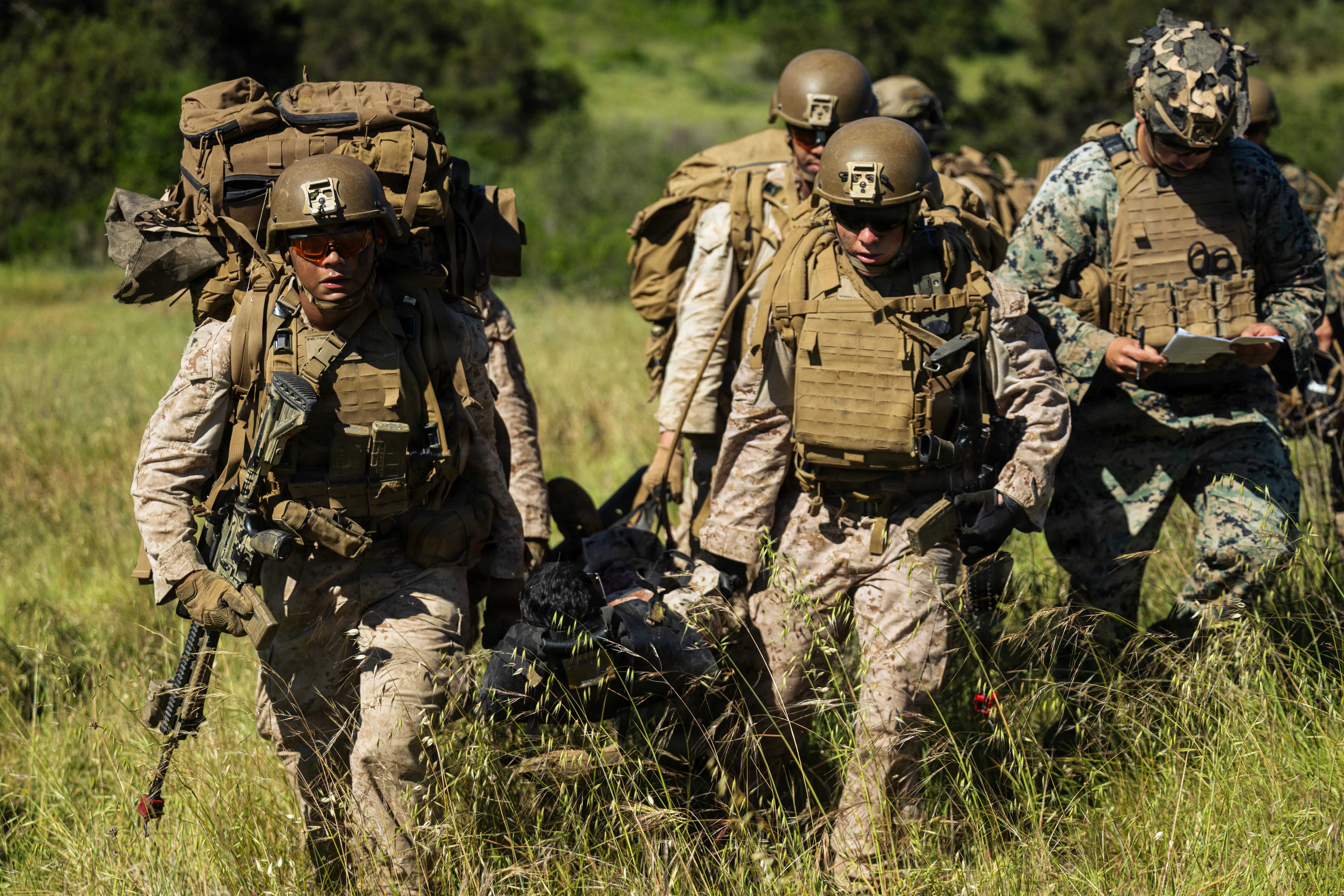 Marines carry a simulated casualty during a tactical competition at Marine Corps Base Camp Pendleton, California, March 18, 2026.