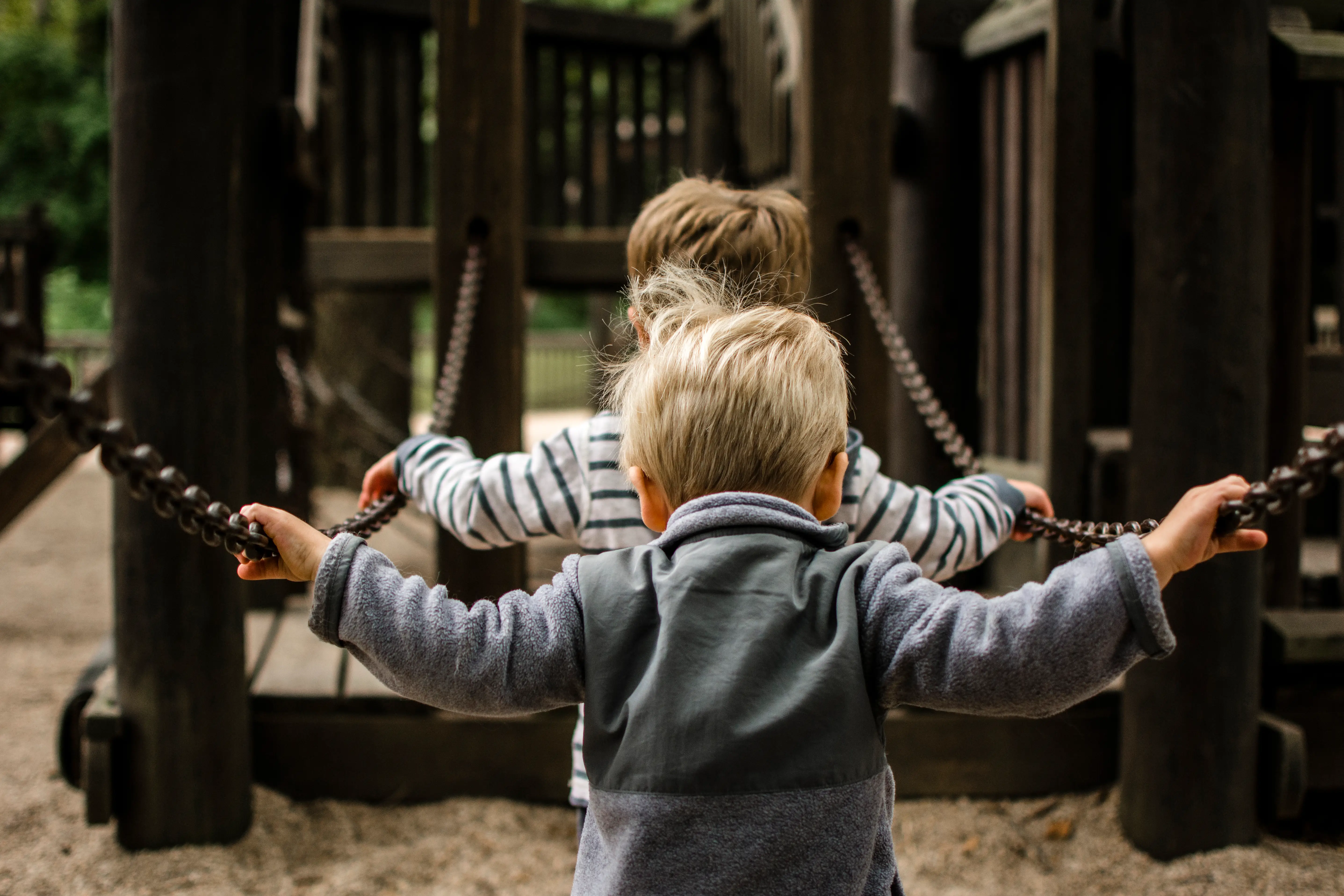 two kids on bridge at playground