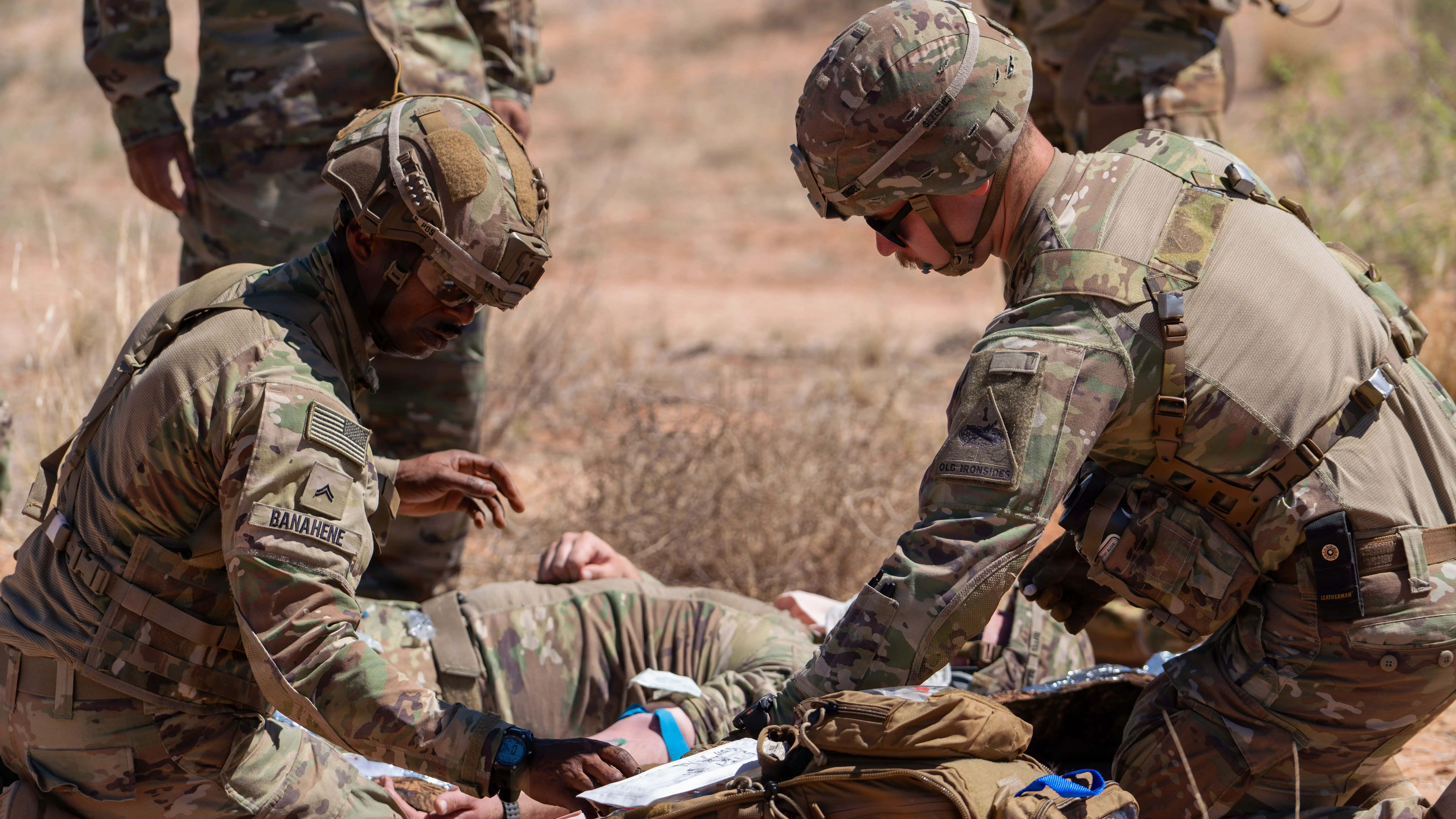 US soldiers establish IV access on a simulated casualty in preparation for air medical evacuation during a training exercise at Fort Bliss, Texas