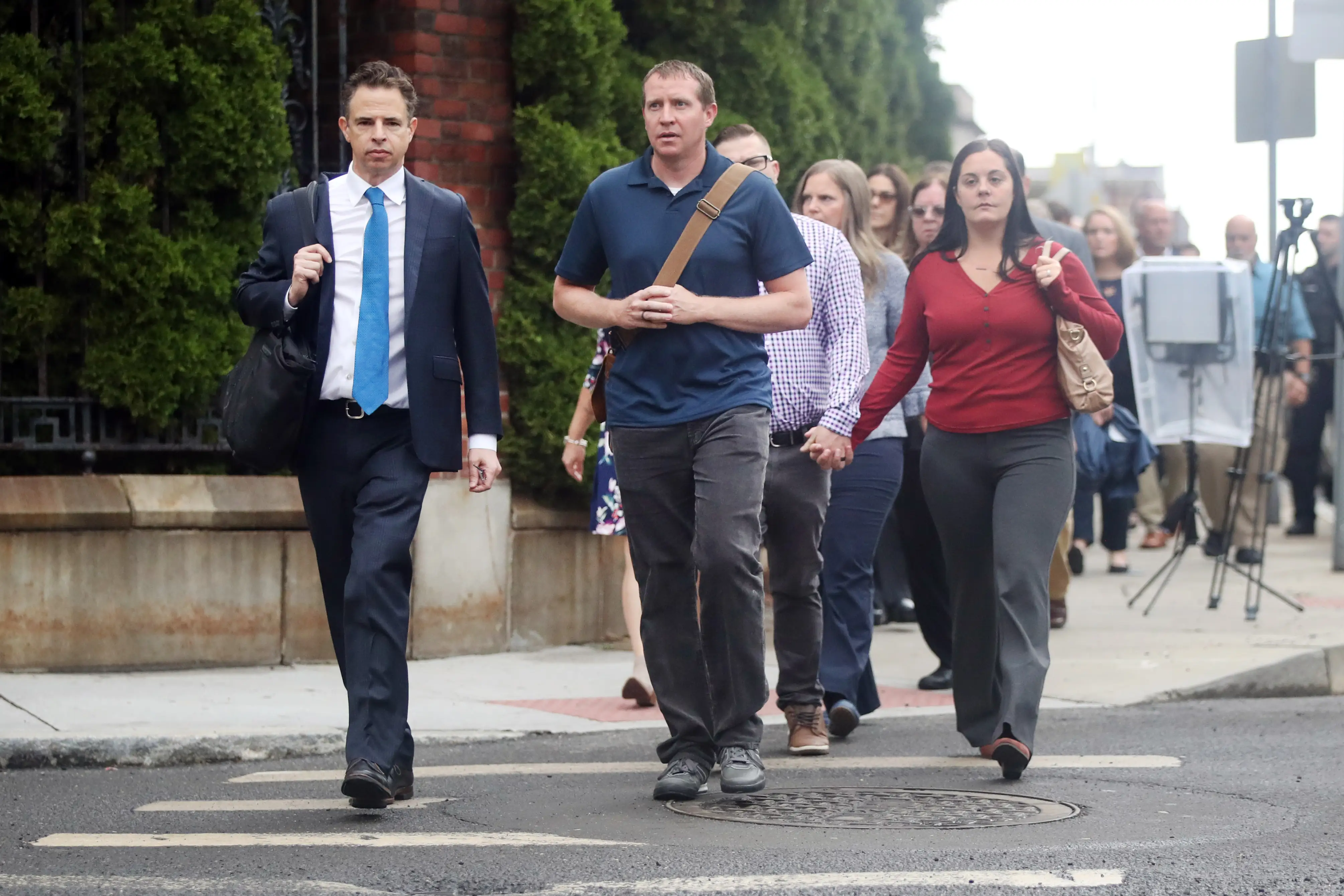 Families walk into Alex Jones' trial