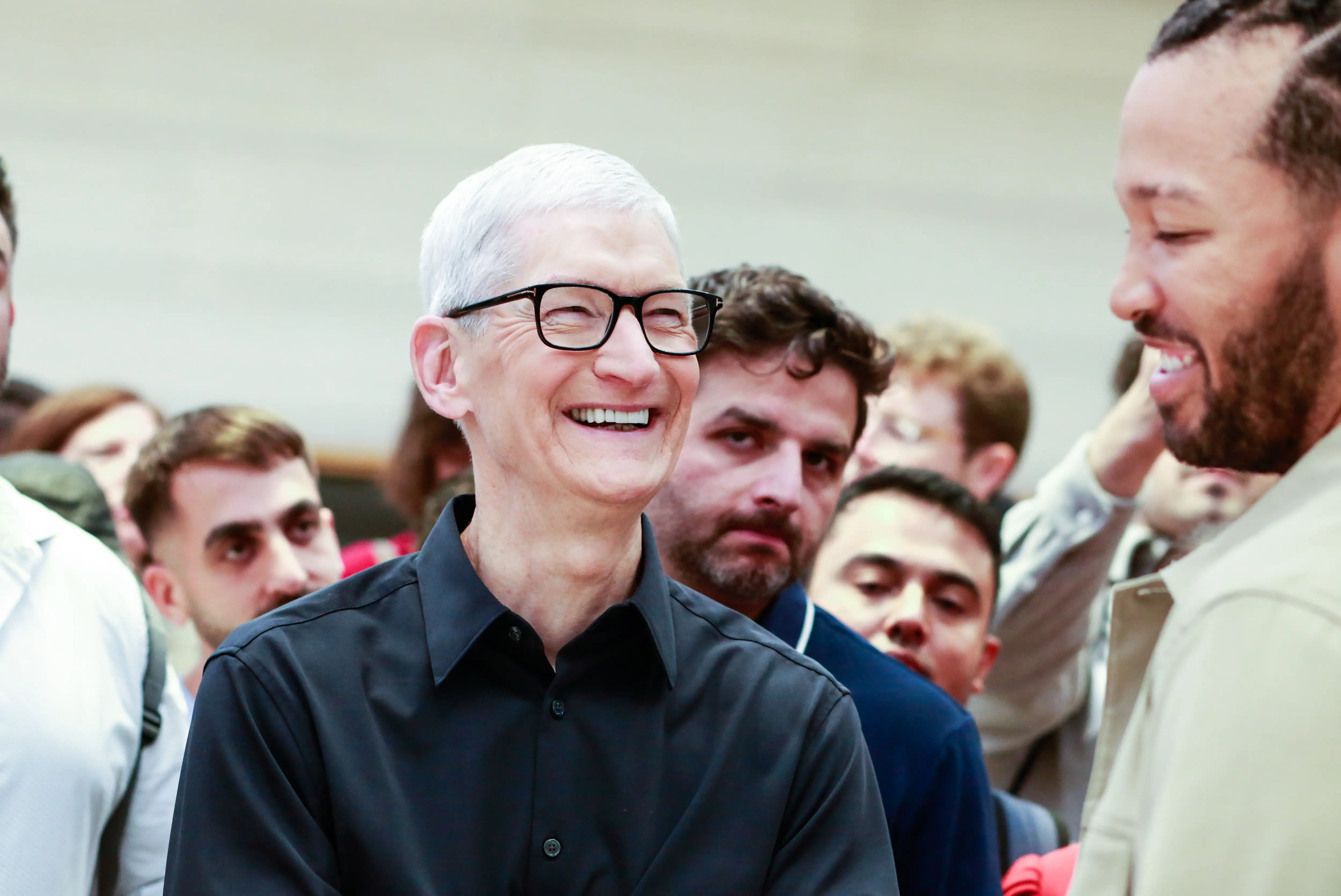 Apple CEO Tim Cook laughing
