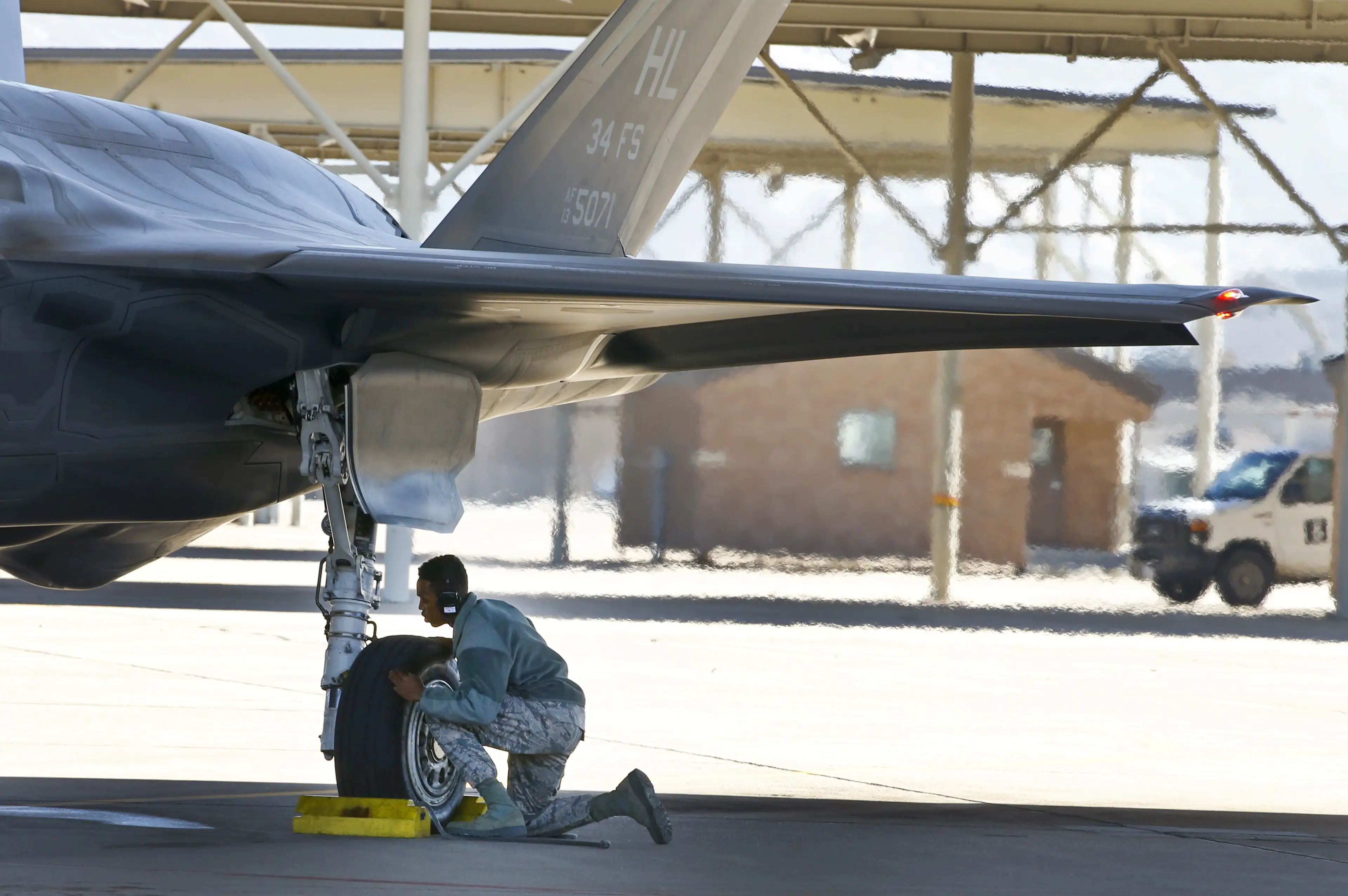 A maintenance technician prepares a Lockheed Martin F-35A jet for a training flight.