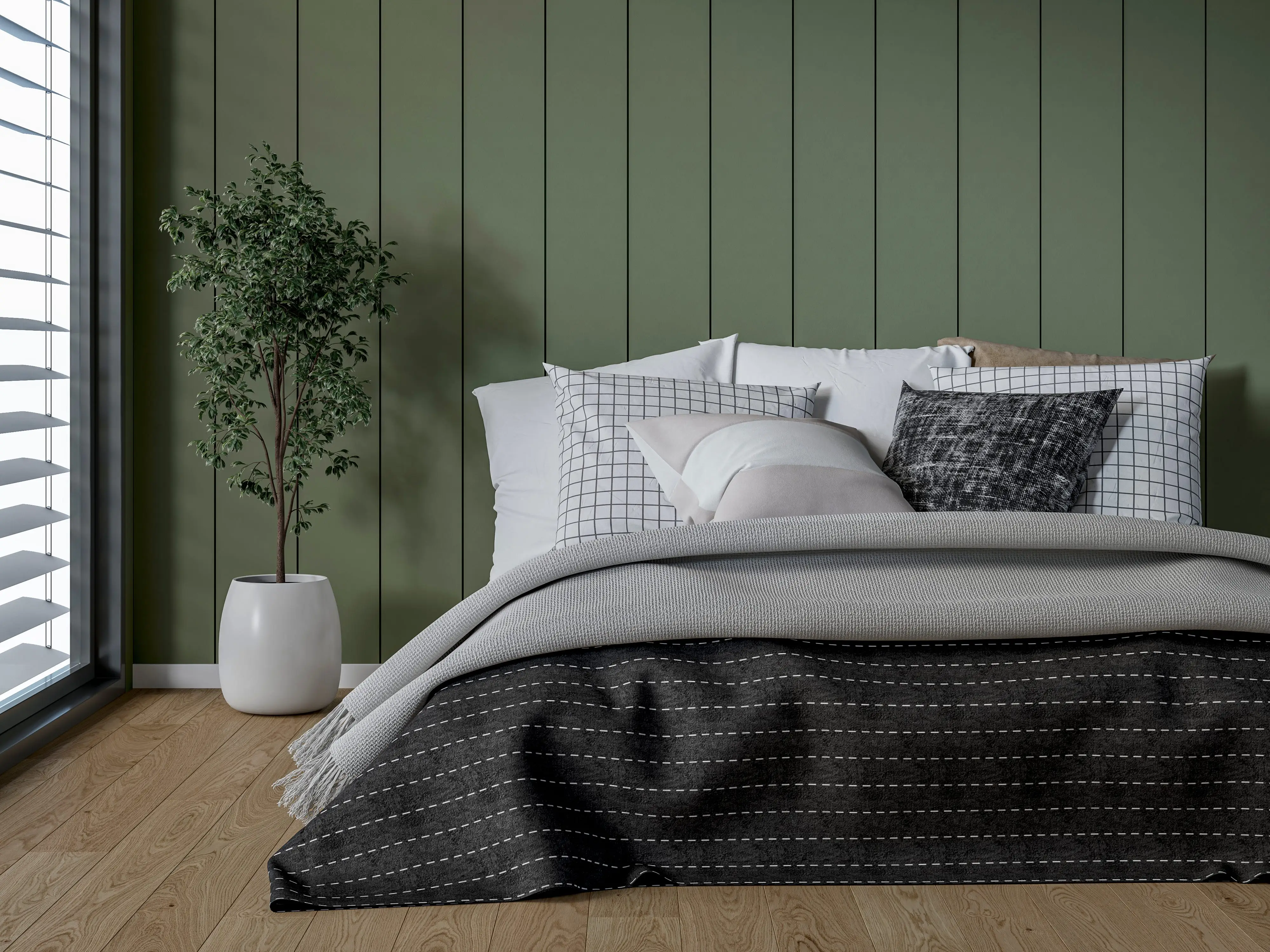 A bedroom with dark-green walls, a bed, and a plant.