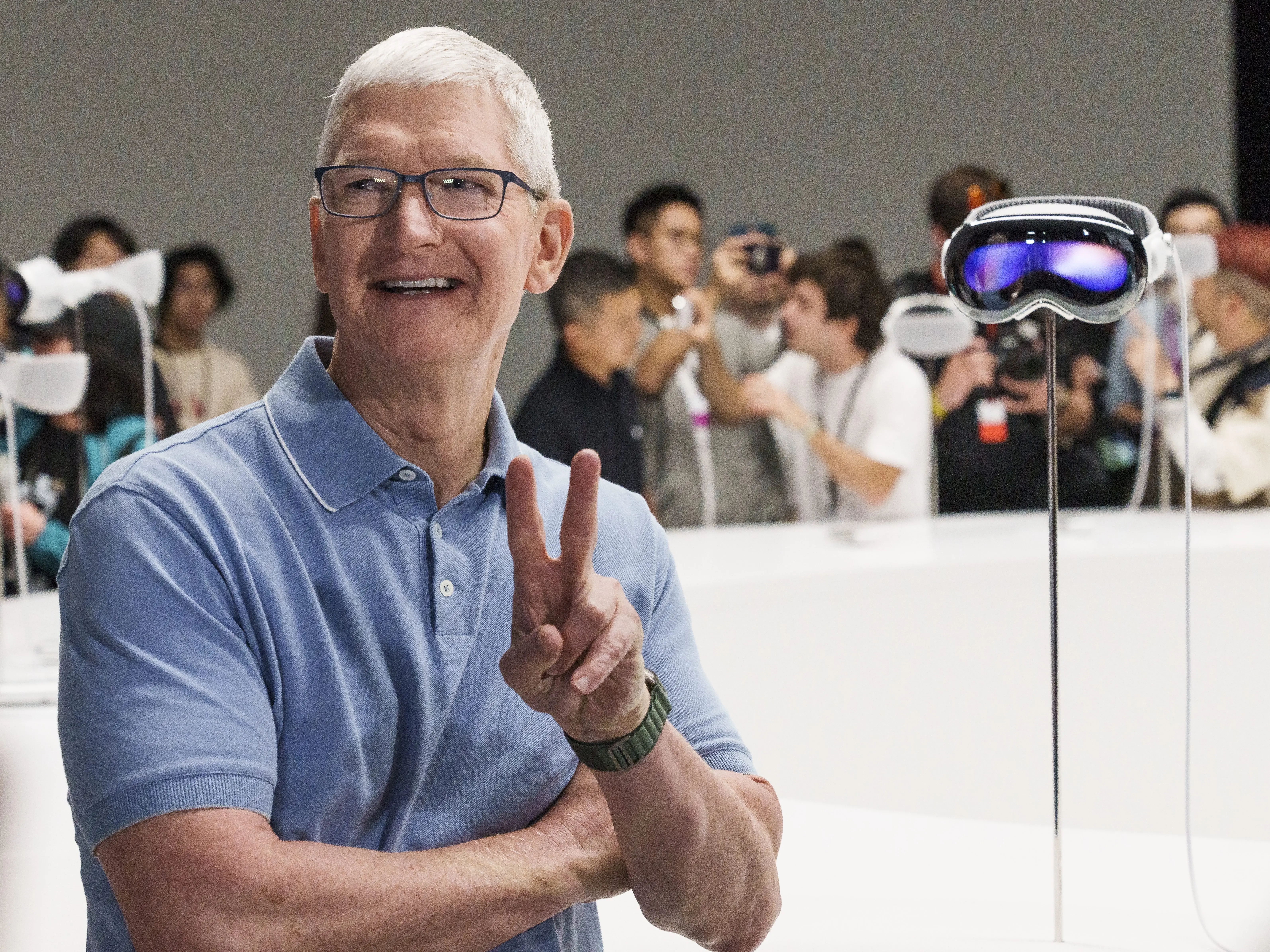Tim Cook poses with a 