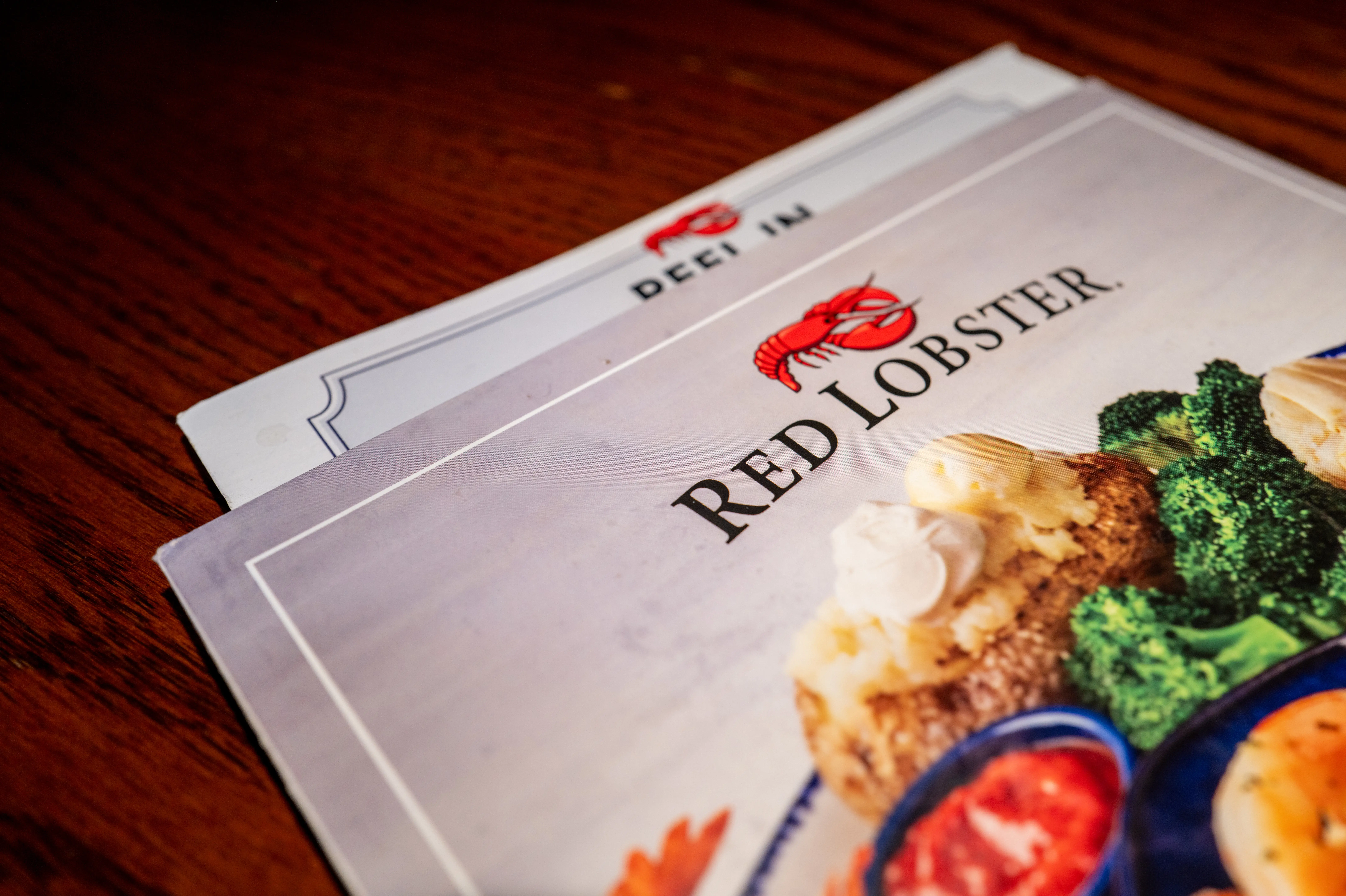 A Red Lobster menu on a dining room table