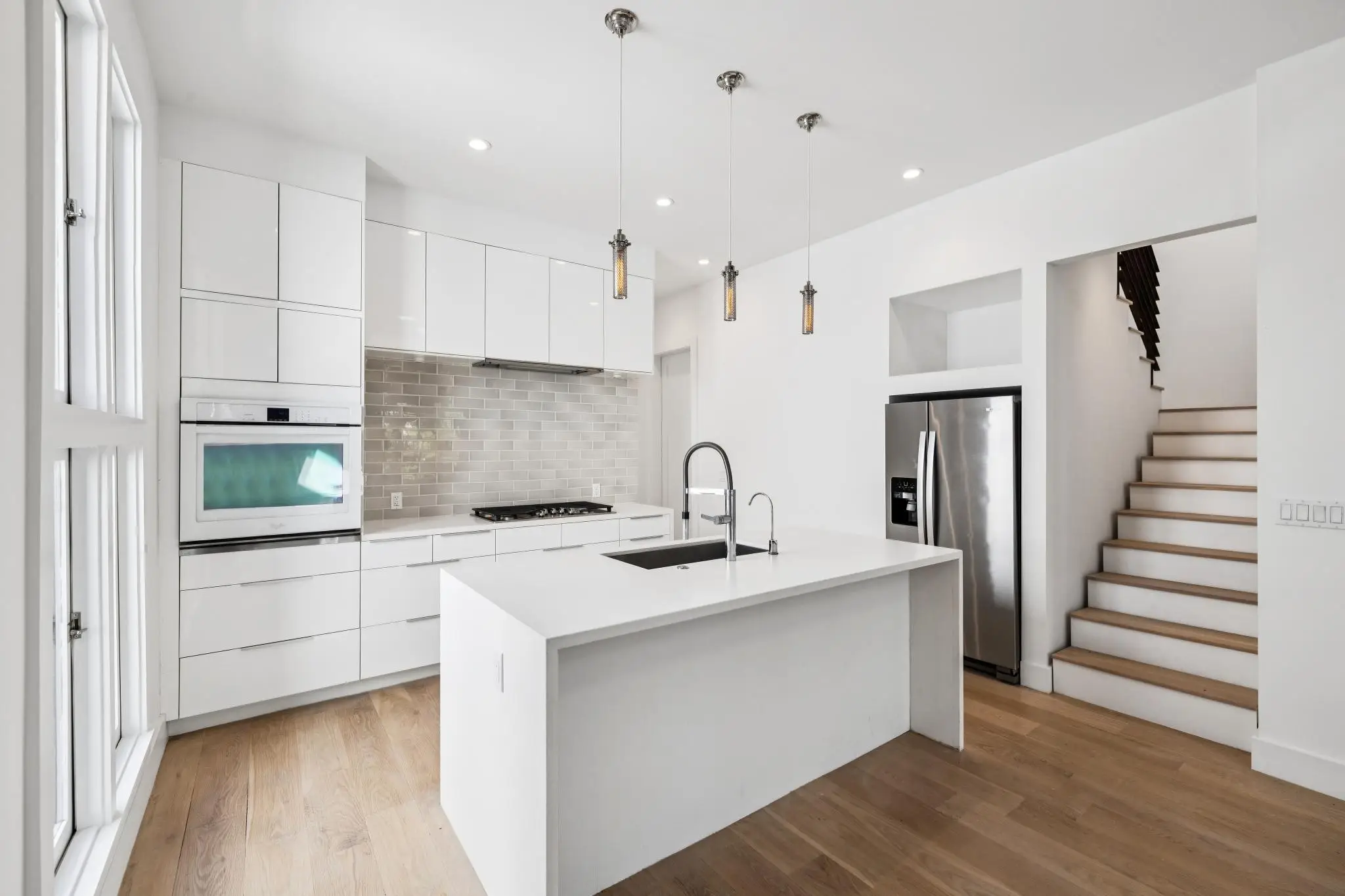 The 1,816-square-foot apartment features three bedrooms, two bathrooms, and two outdoor decks.