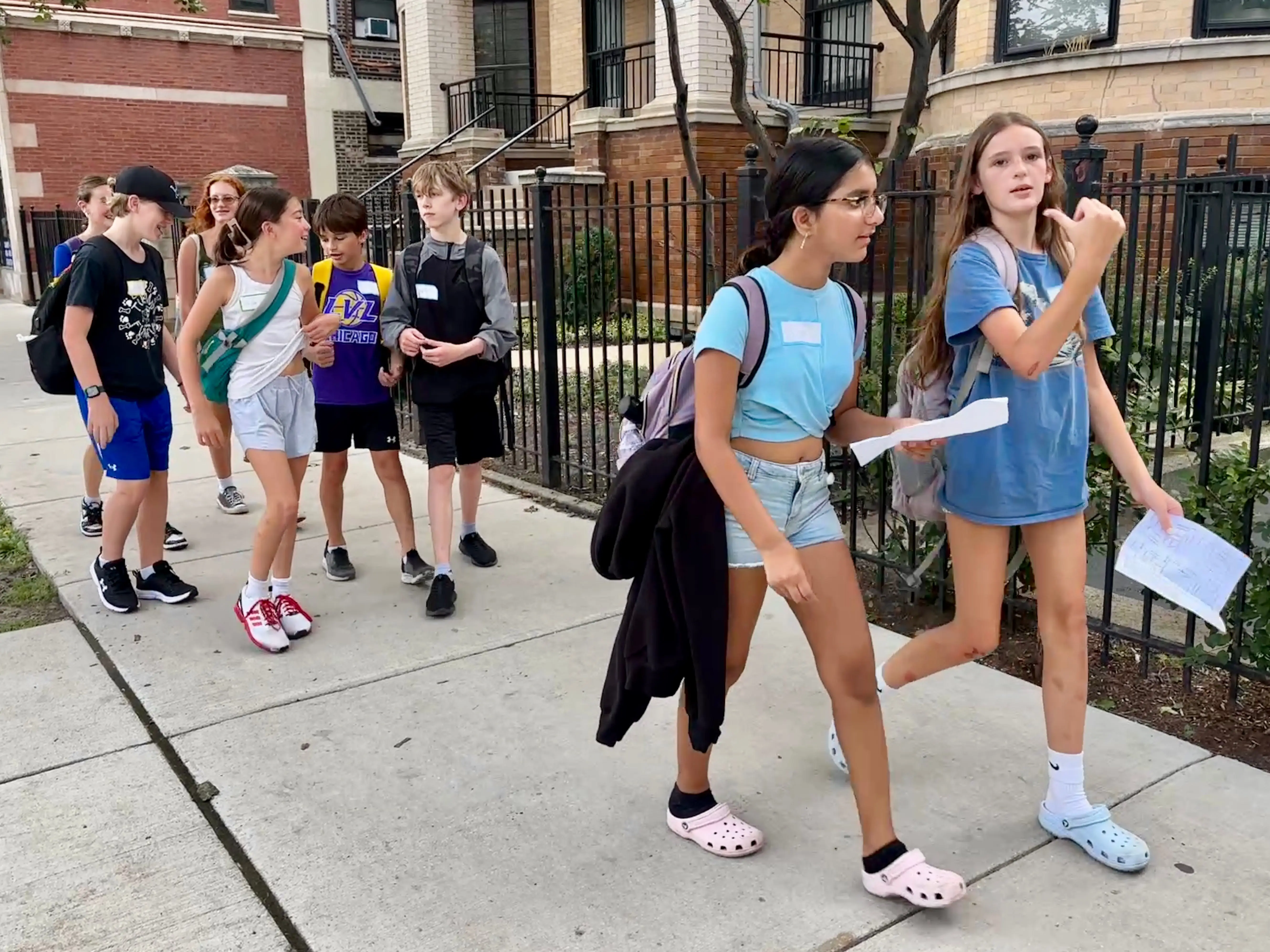 Kids walking with maps