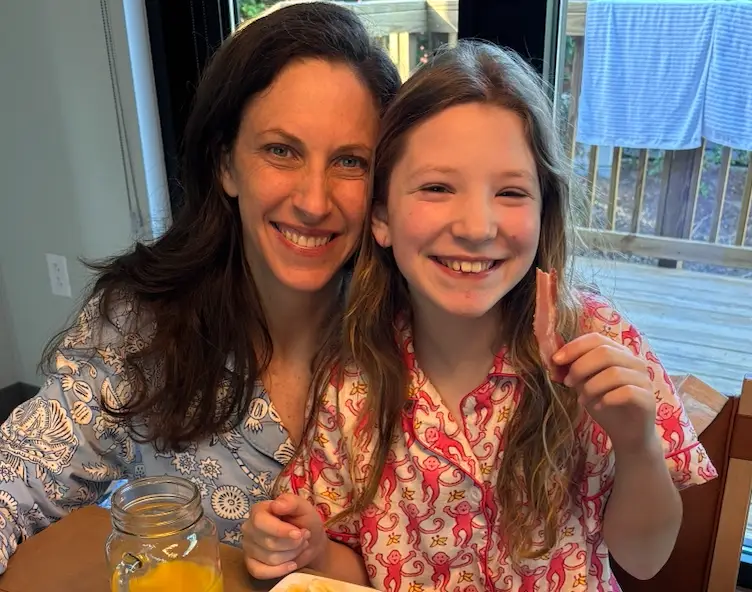 Lauren Manaker and daughter at table