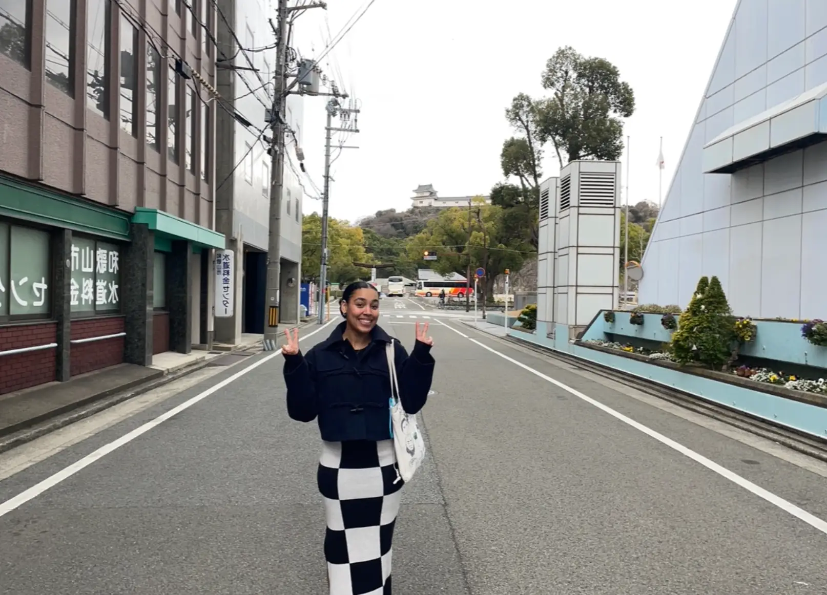 The writer standing in the middle of a street in Japan.