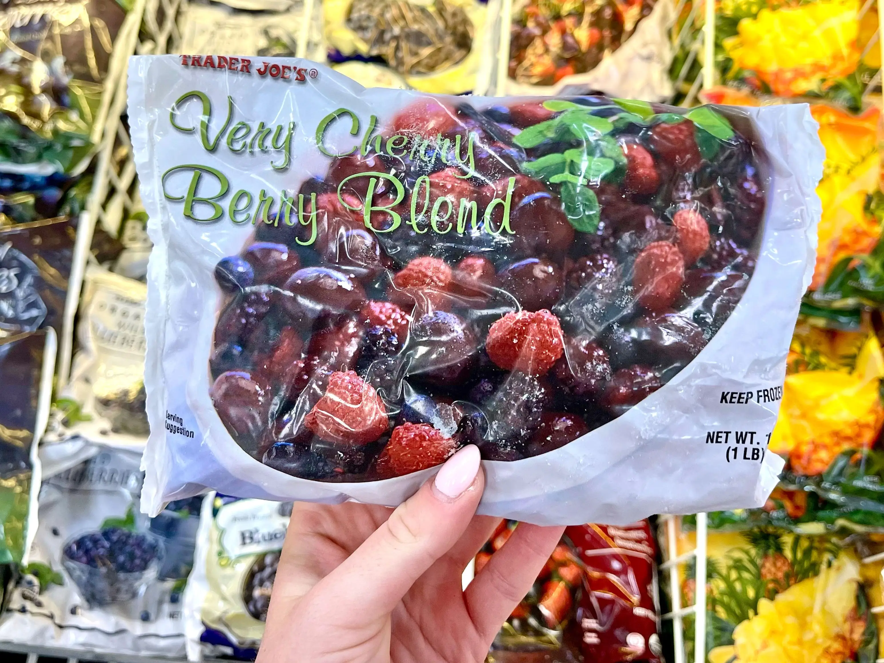 Serena holds a bag of Trader Joe's frozen berries.