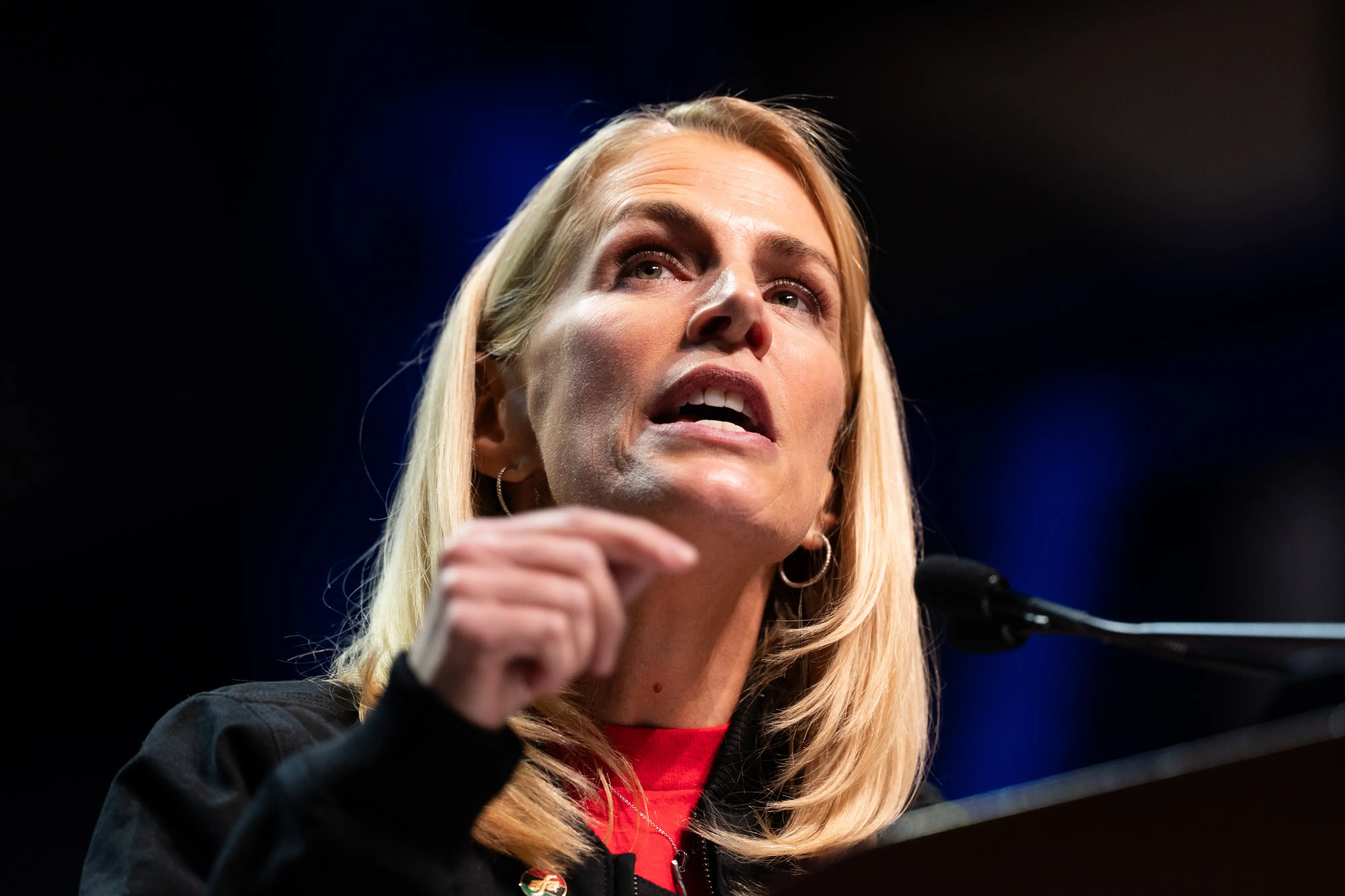Sara Nelson in front of a microphone