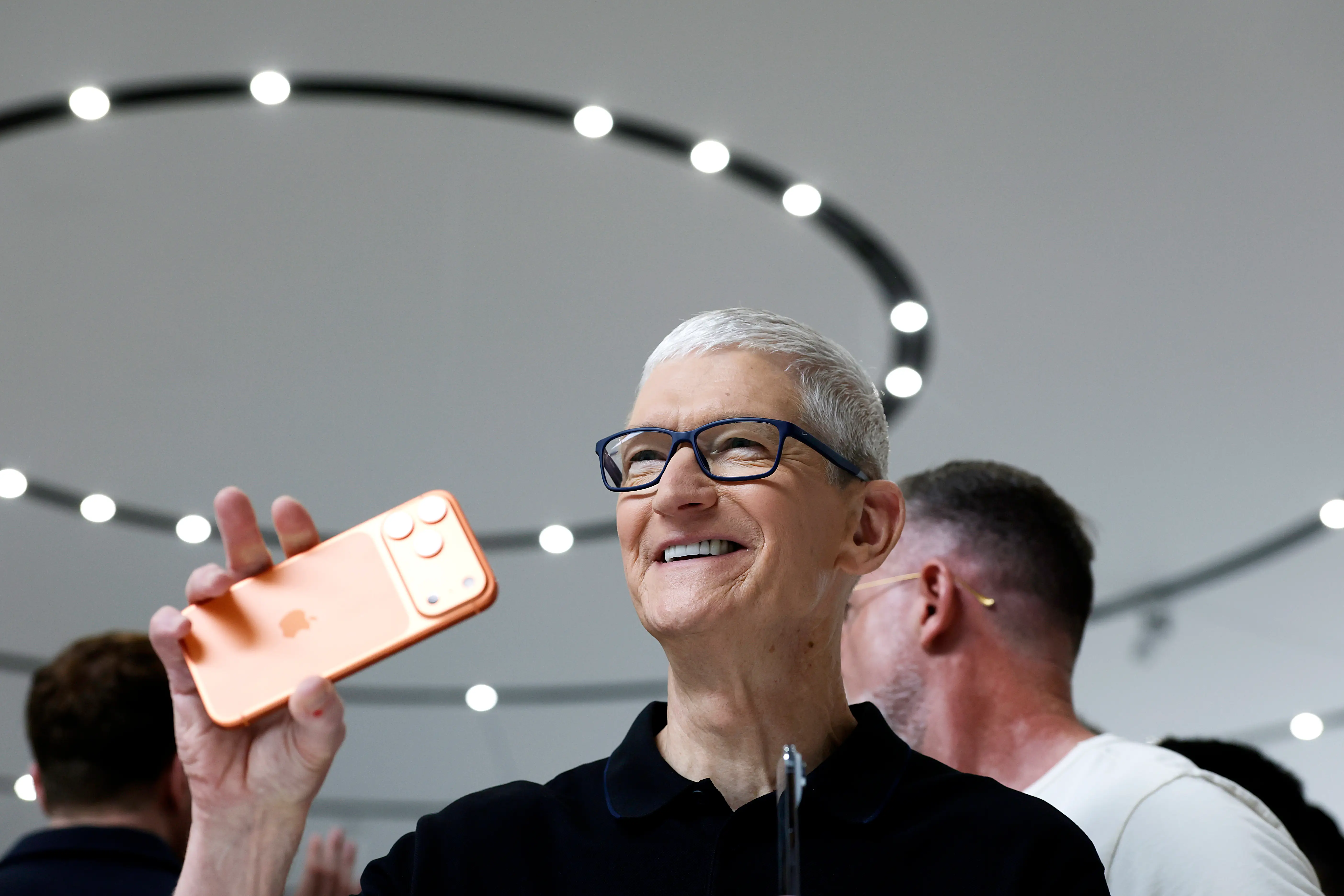 Tim Cook holding iPhone 17 Pro Max