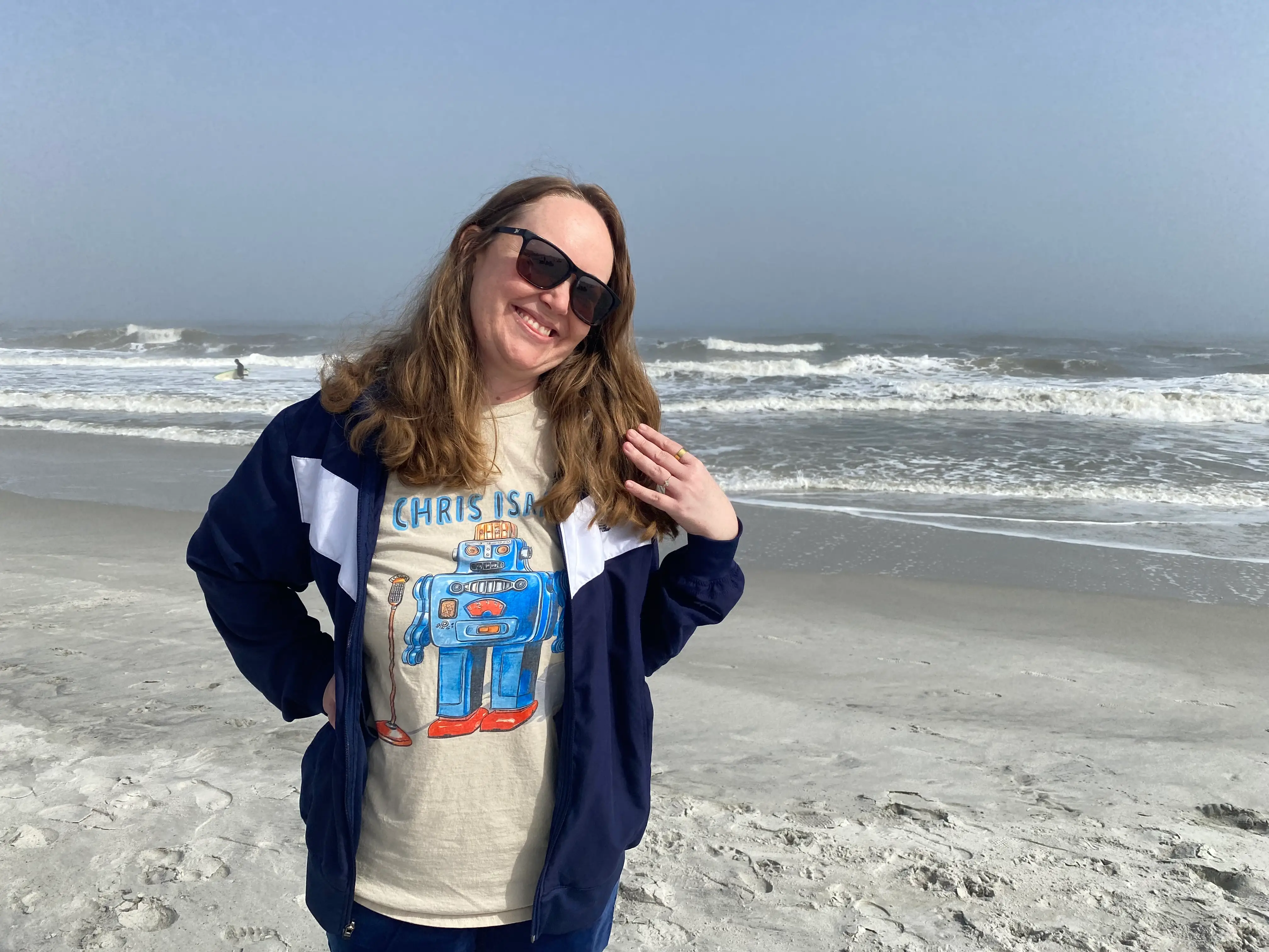 The author poses on a beach.