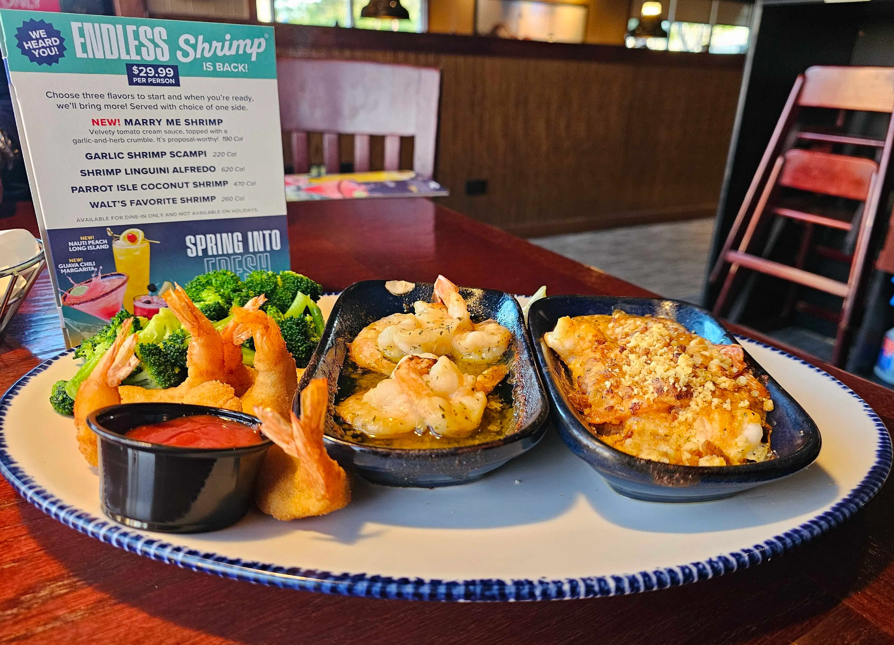 A plate of various Endless Shrimp variations on a diner's table at Red Lobster