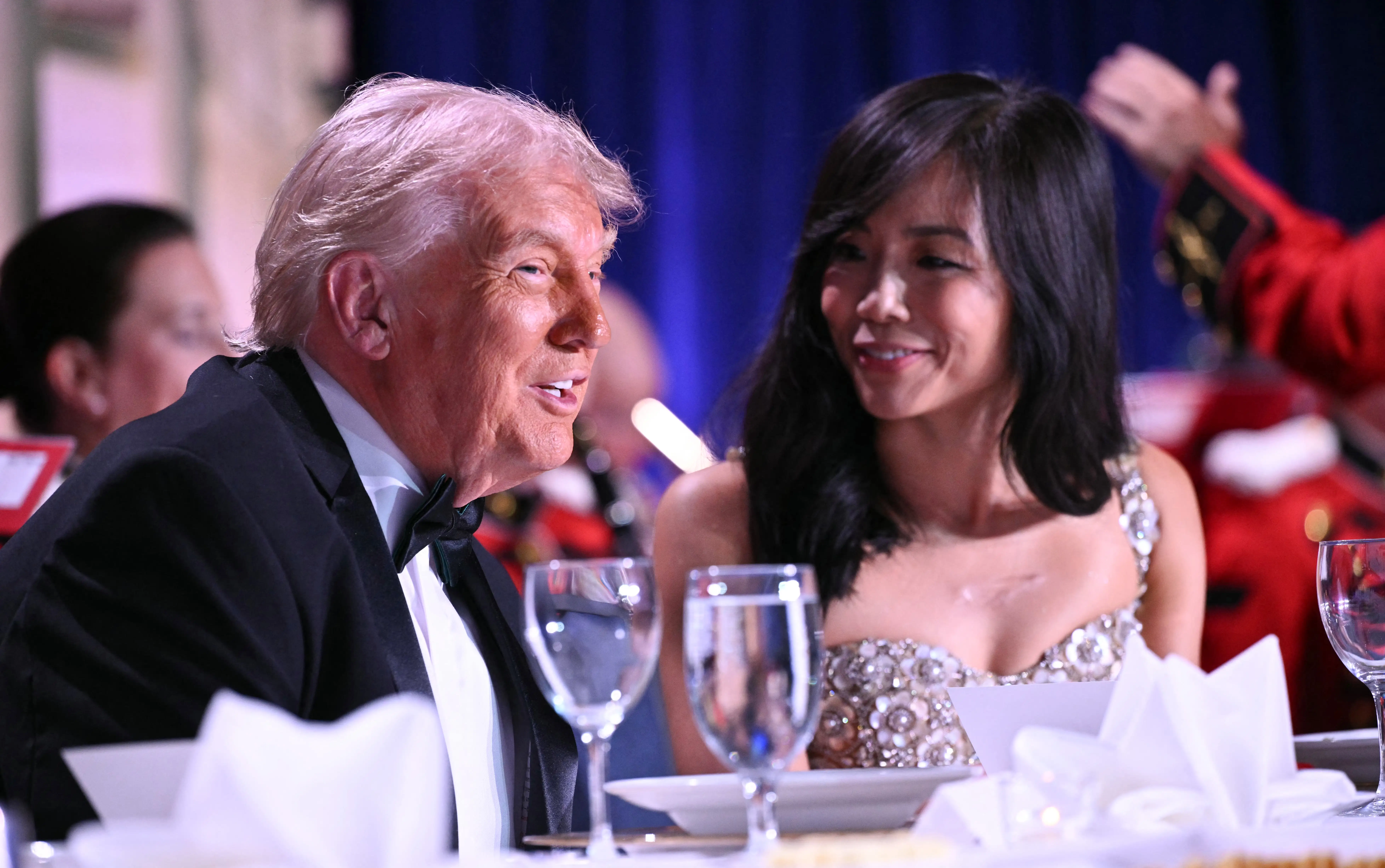 US President Donald Trump and CBS News senior White House correspondent Weijia Jiang speak as they attend the White House Correspondents' dinner at the Washington Hilton in Washington, DC, on April 25, 2026.