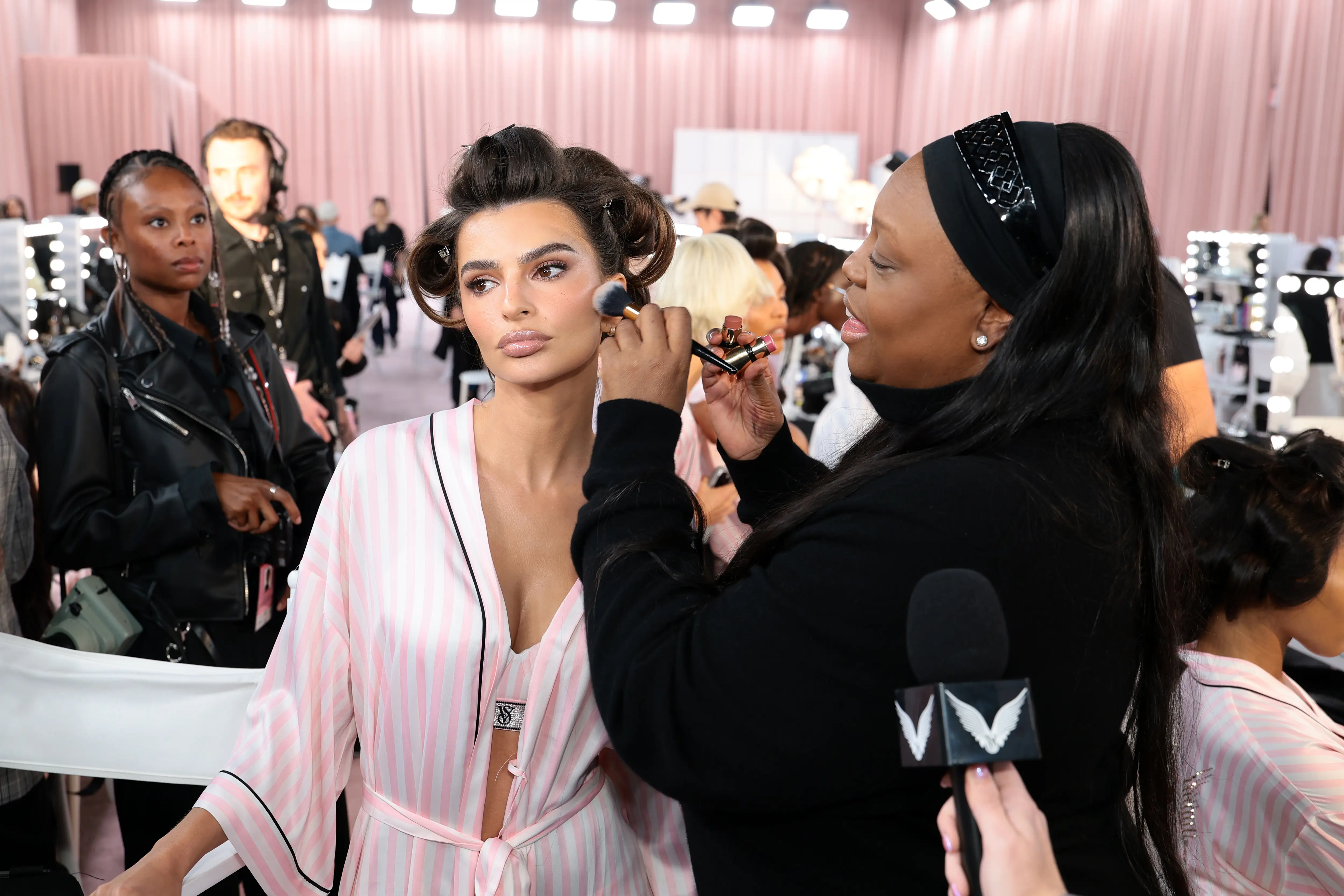Emily Ratajkowski and Pat McGrath prepare backstage at the Victoria's Secret Fashion Show 2025 on October 15, 2025 in New York City.
