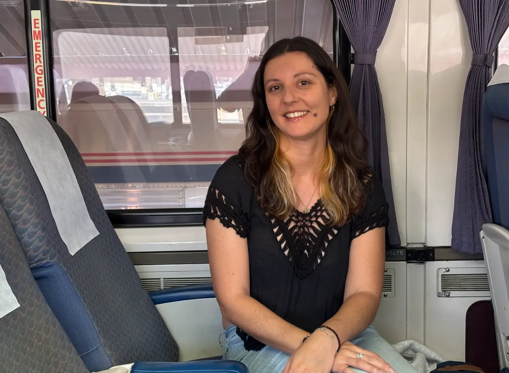 The writer sitting on the Amtrak Pacific Surfliner train.