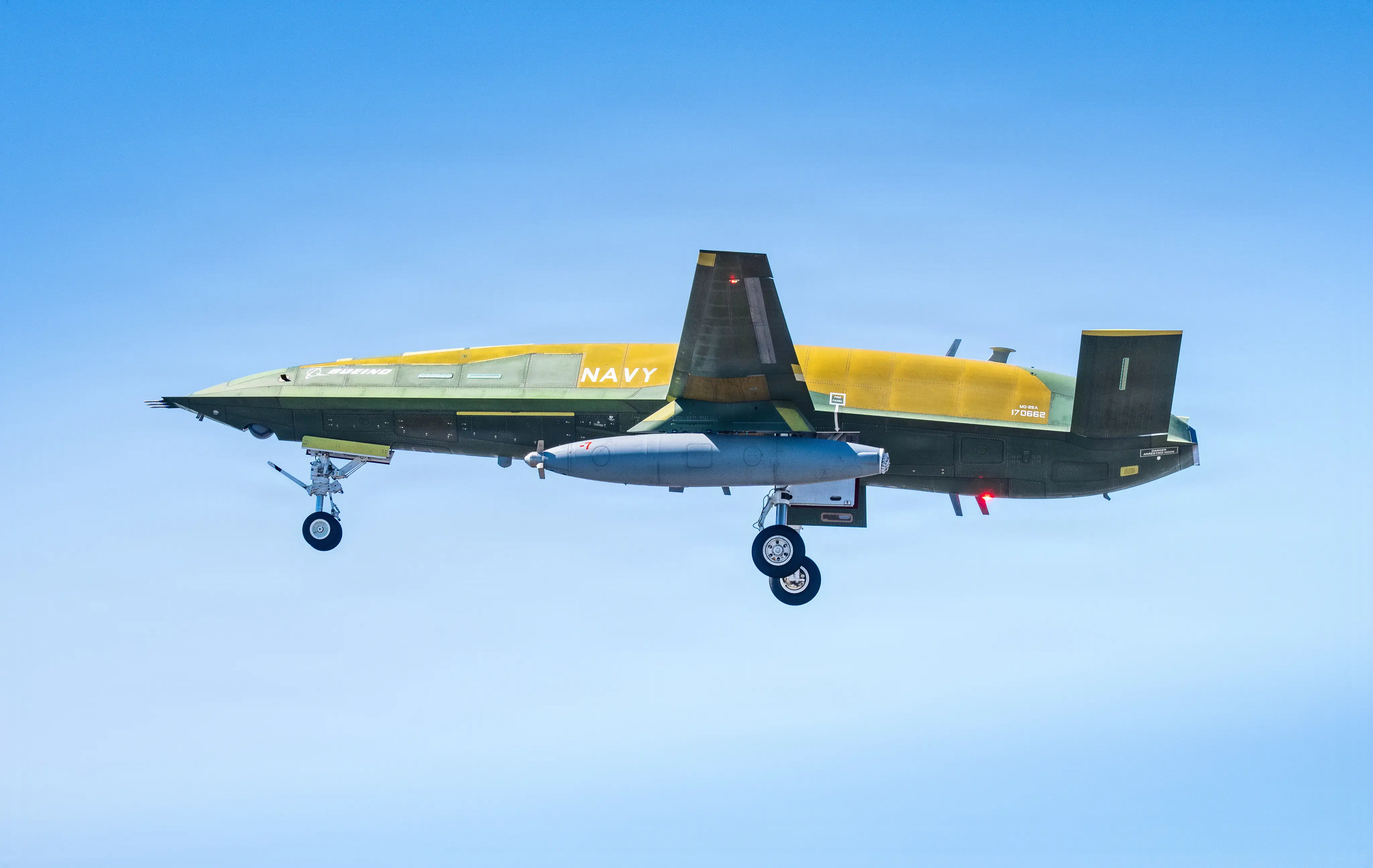 The BQ-25A Stingray flies in a blue sky.