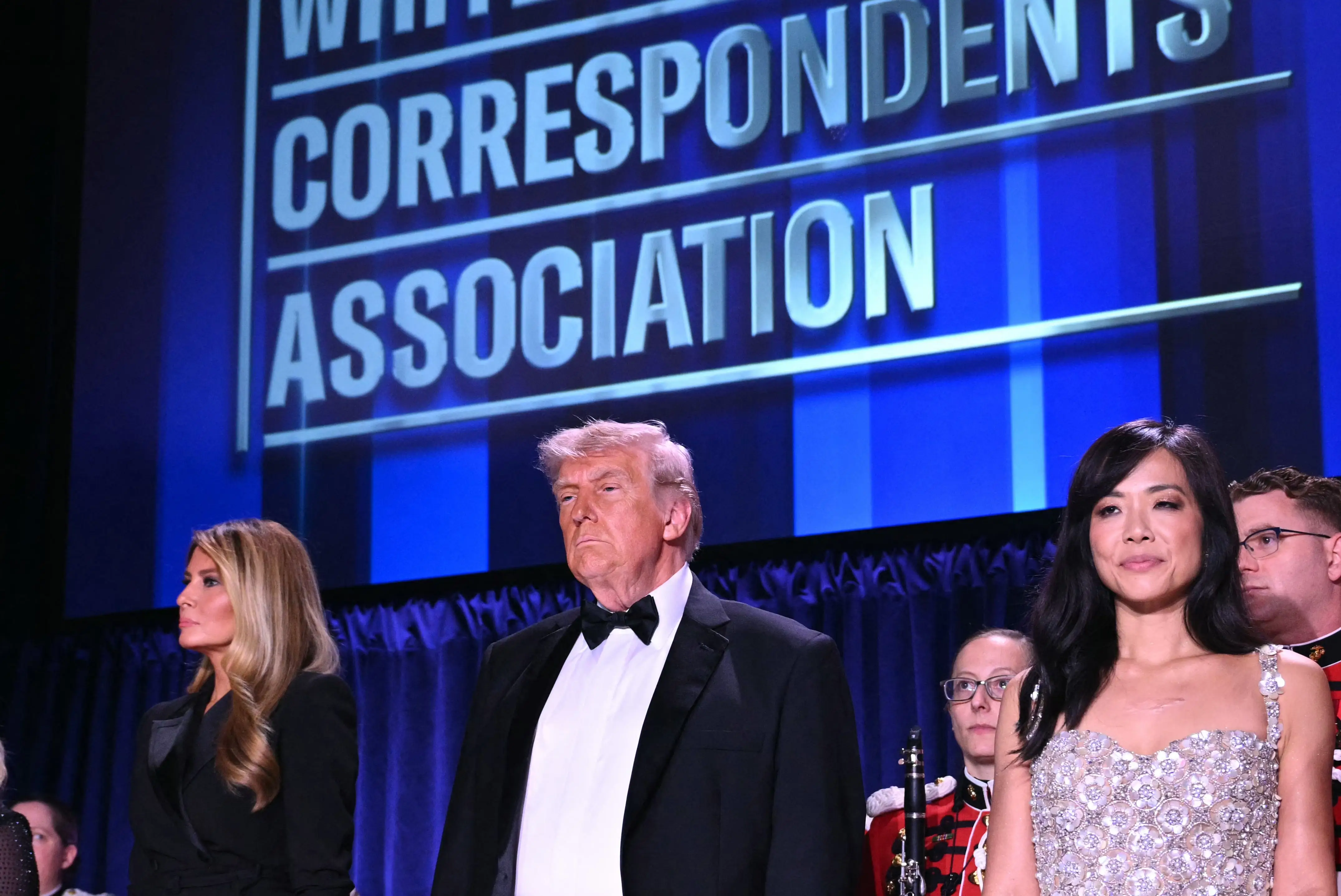 Weijia Jiang, President Donald Trump and Melania Trump stand at the White House Correspondents' Dinner