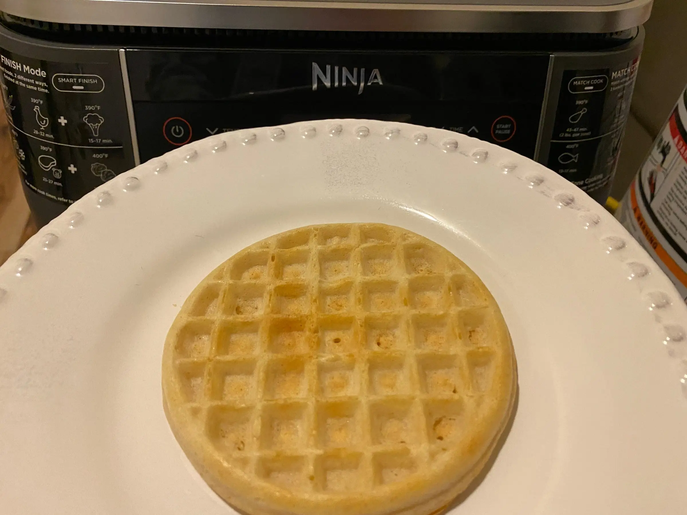 waffle on plate in front of air fryer