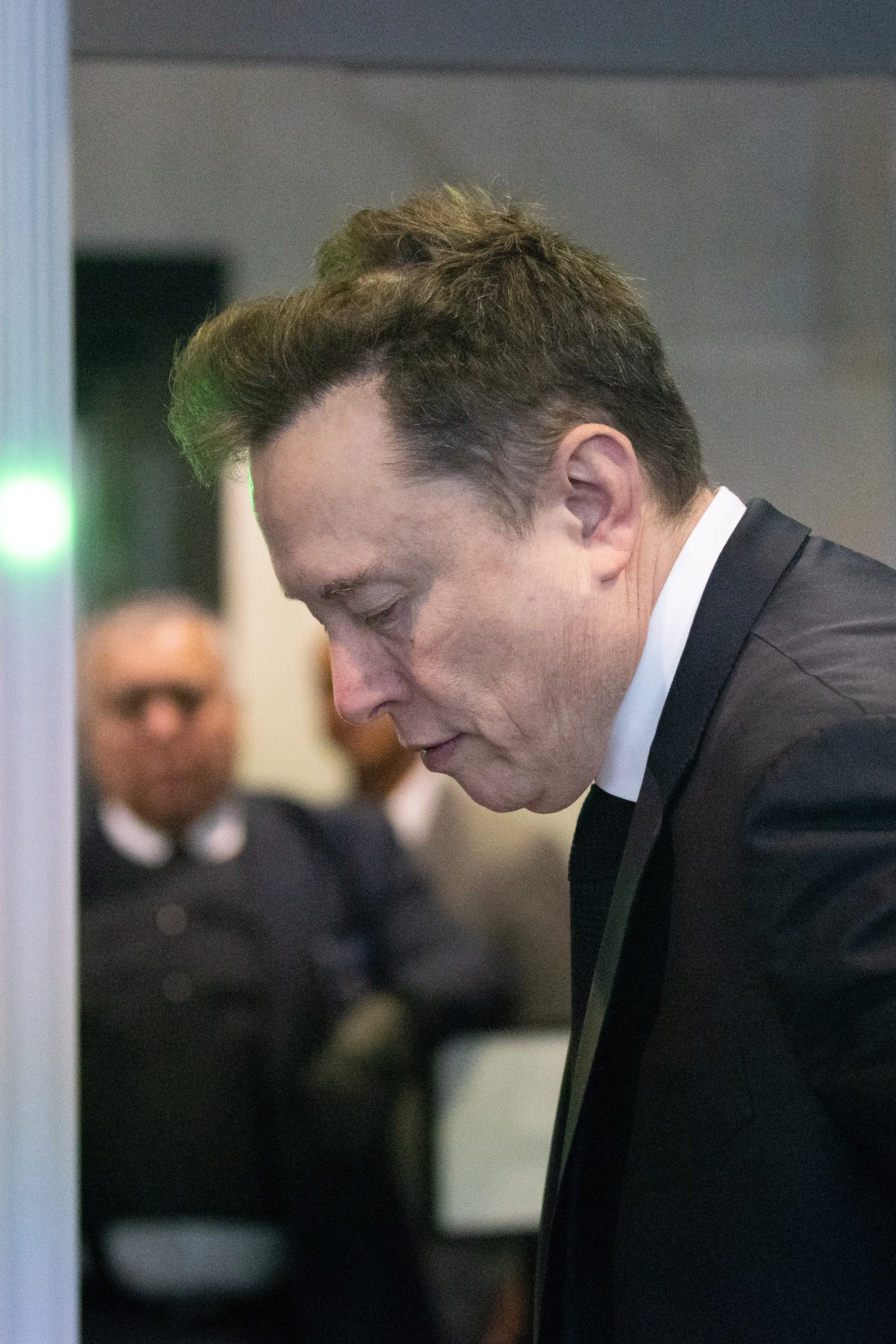 Elon Musk goes through courthouse security
