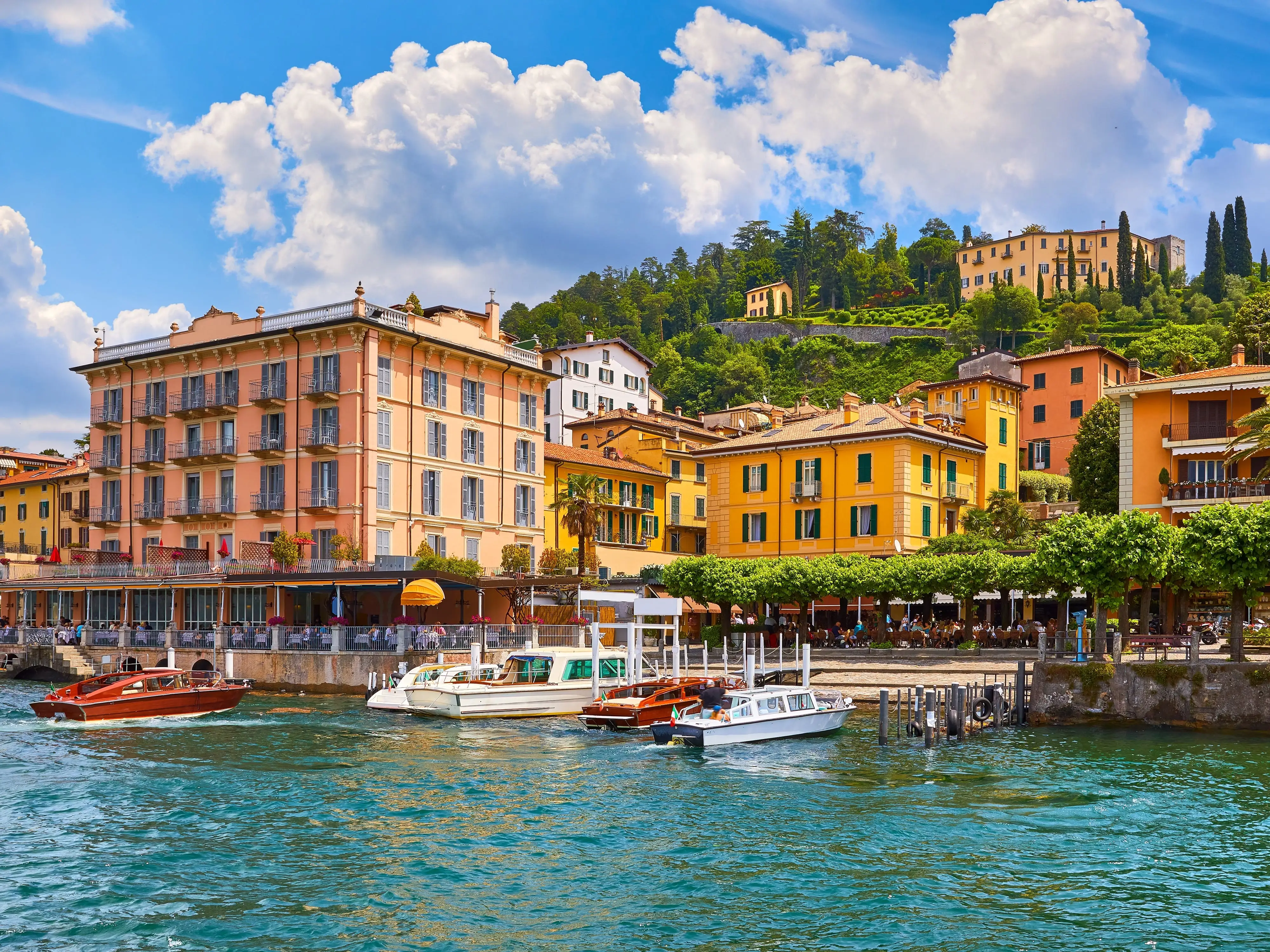Boats on the water in front of buildings in Bellagio, Lake Como, Italy.