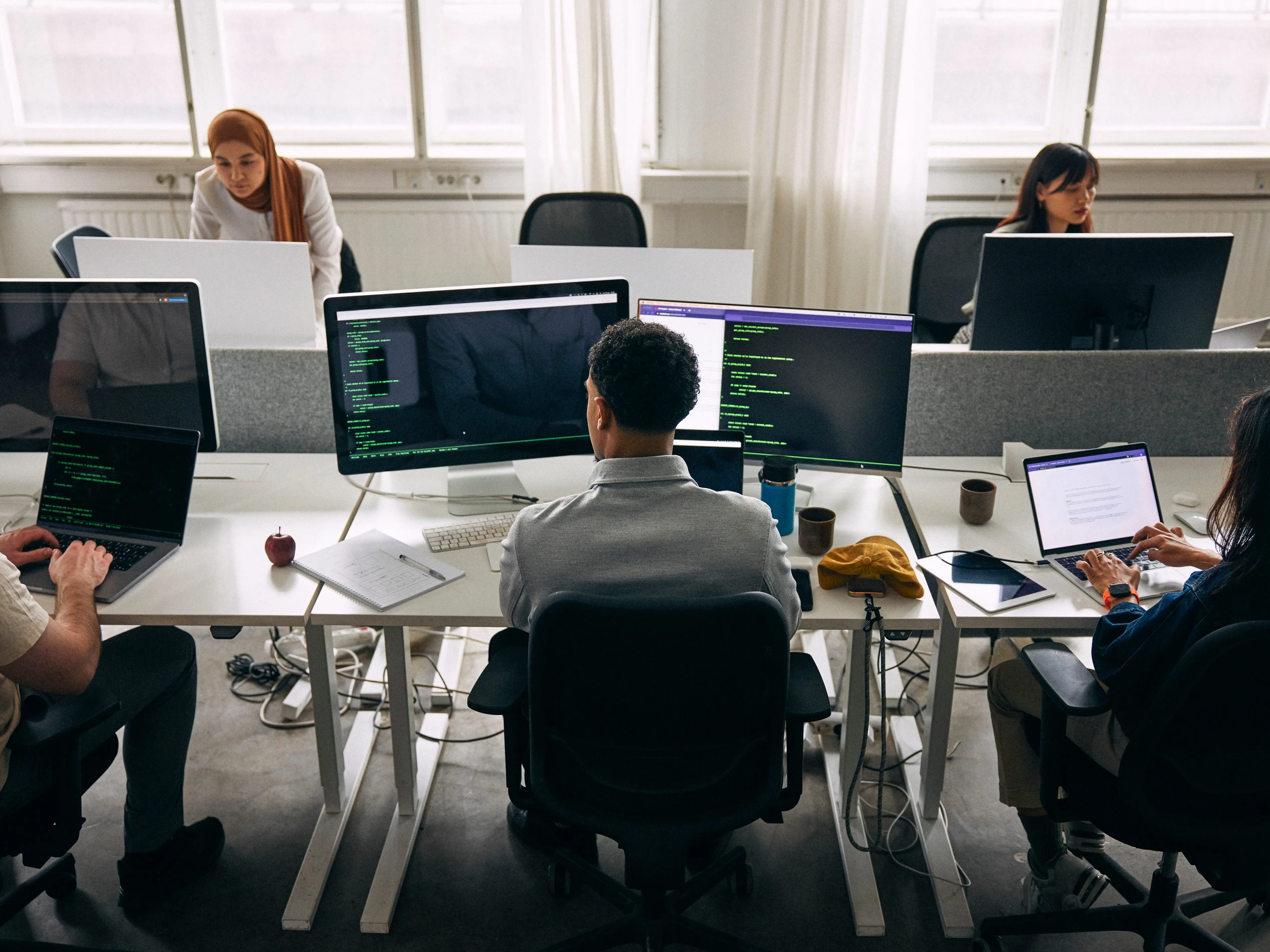 Workers looking at computers