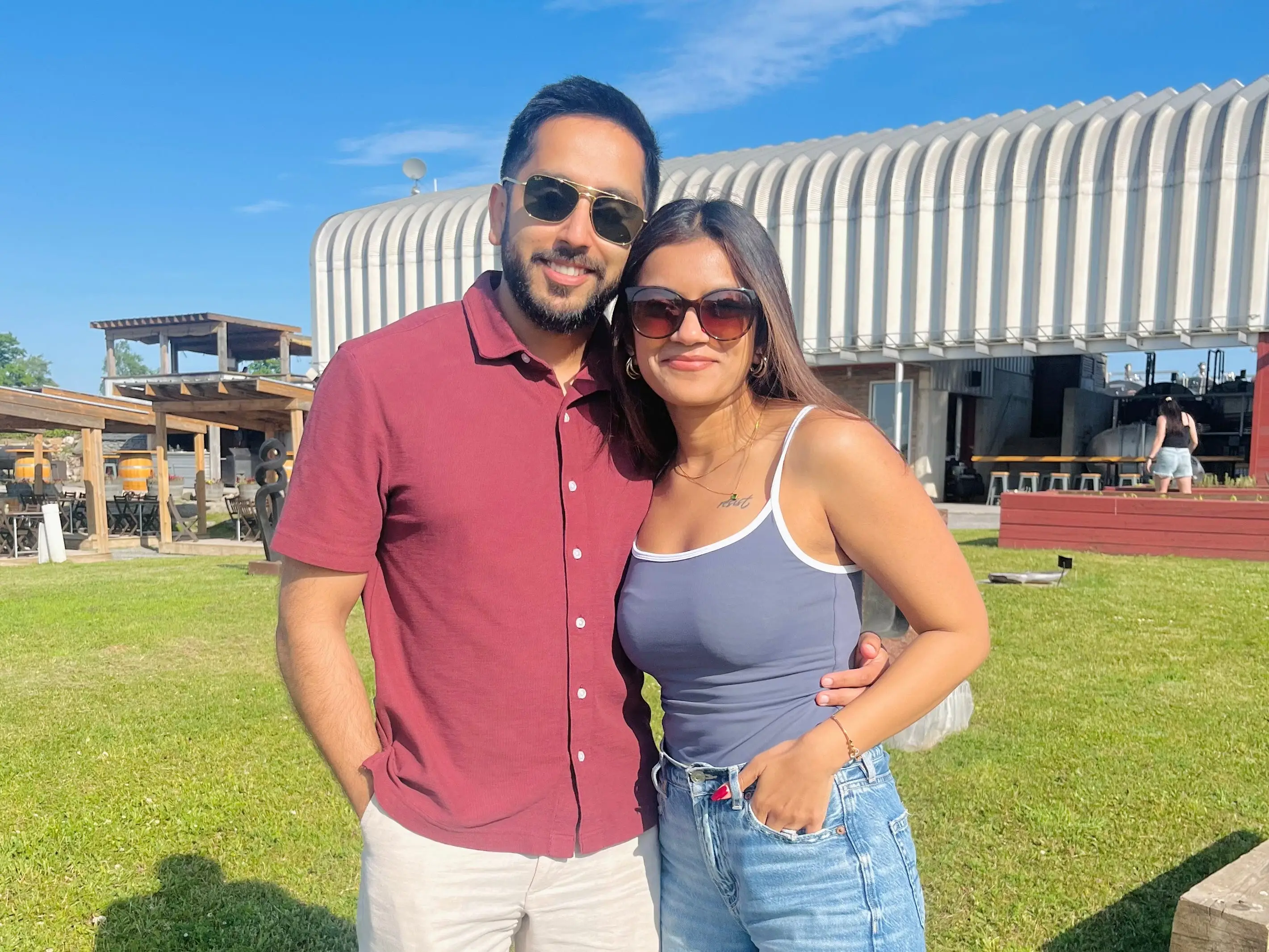 Vaishali Gauba and her husband are posing together for a photo.
