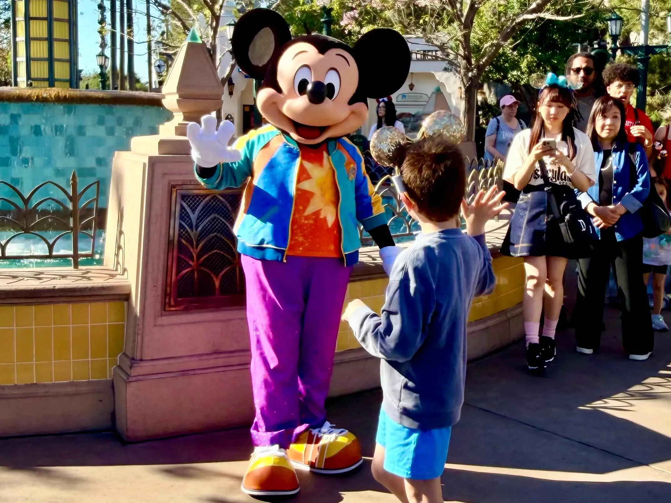 The author's son meeting Mickey Mouse at Disneyland.