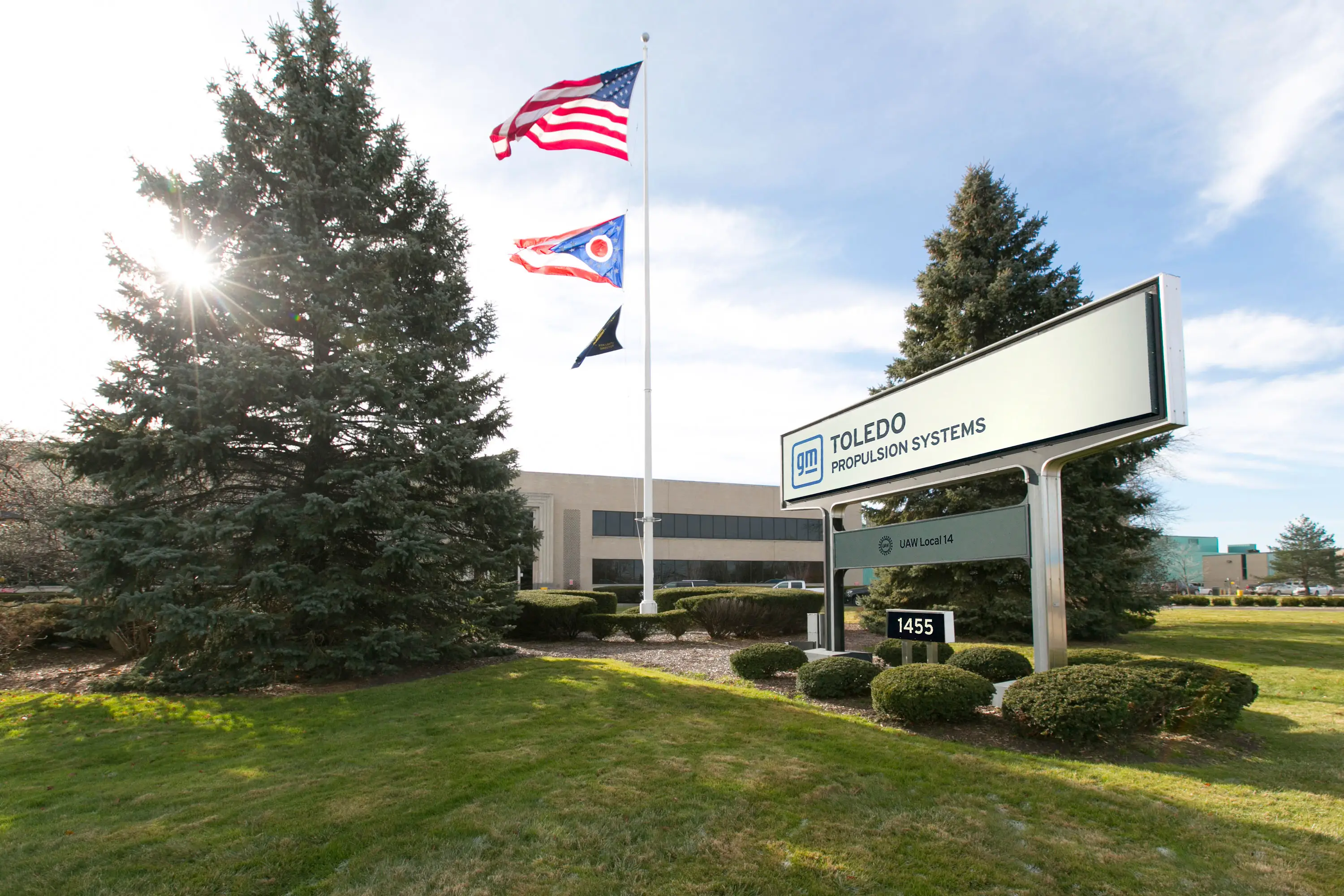 The sun is shining on a sign outside GM's Toledo propulsion systems plant.