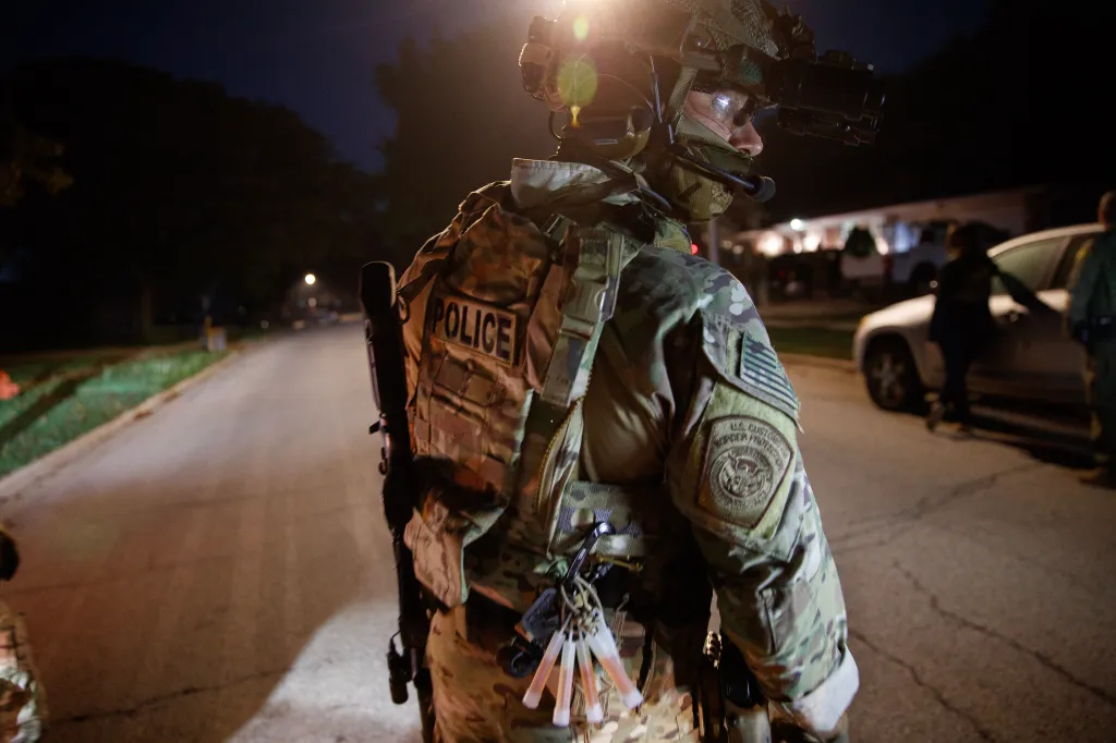 Customs and Border Patrol agents execute a warrant for a wanted man in the Chicago area in September 2025.