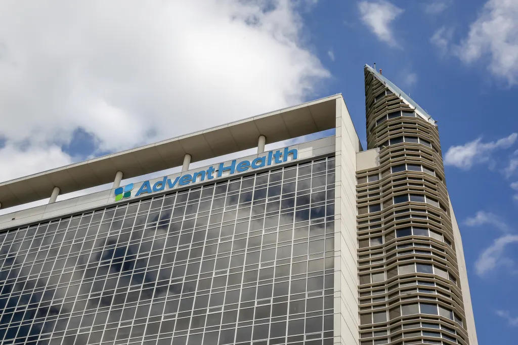 AdventHealth Orlando building with a blue sky background.