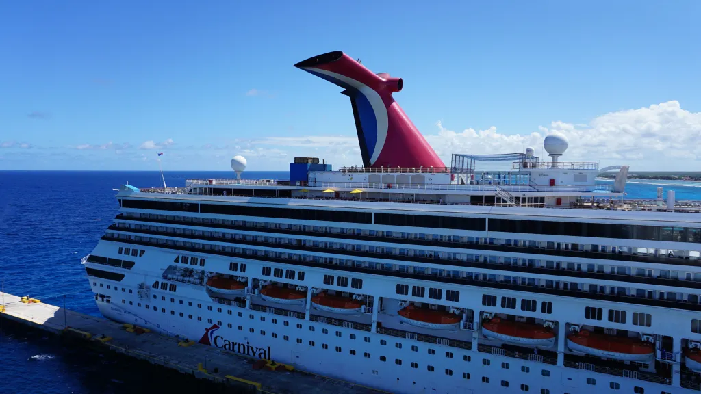 The concept blends elements of Carnival's existing food partnerships, including Guy Fieri's Pig & Anchor BBQ and Shaquille O'Neal's Big Chicken, though it is not officially tied to either brand.