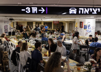 Israelis celebrate Passover in a parking garage turned bomb shelter
