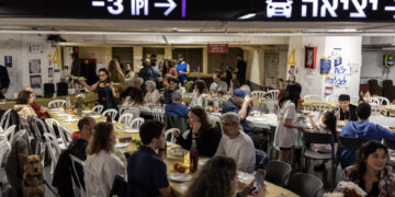 Israelis celebrate Passover in a parking garage turned bomb shelter