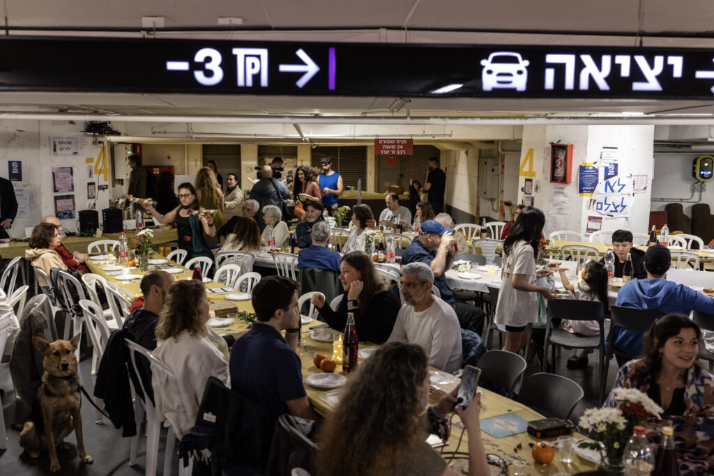 Israelis celebrate Passover in a parking garage turned bomb shelter