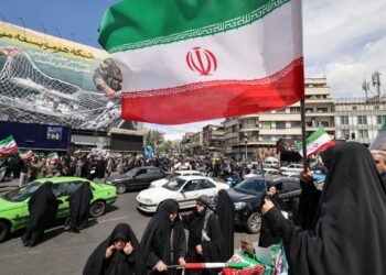 After Trump pauses war, Iranians fly flags of victory, not surrender